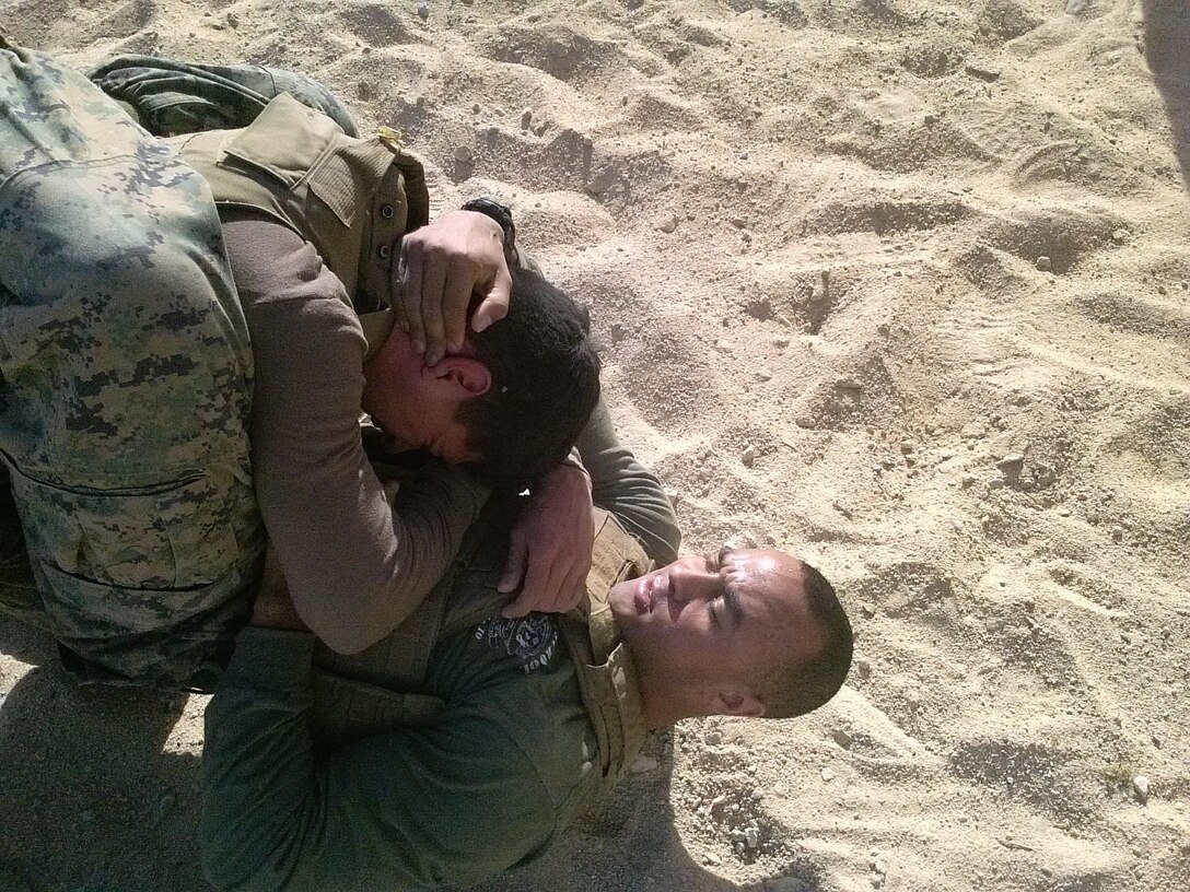 Sgt. Ryan-Michael Daffin, an avionic technician with Marine Light Attack Helicopter Squadron (HMLA) 267, demonstrates proper technique during one of his Marine Corps Martial Arts Program sessions aboard Marine Corps Air-Ground Combat Center Twentynine Palms, Calif., Jan. 28. Daffin incorporated Committed and Engaged Leadership principles through his MCMAP sessions in order to better the Marines around him. 