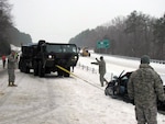 South Carolina National Guard members support the state Department of Public Safety along I-26 looking for stranded motorists on Feb. 12, 2014, in the wake of Winter Storm Pax, as the Weather Channel calls the storm.