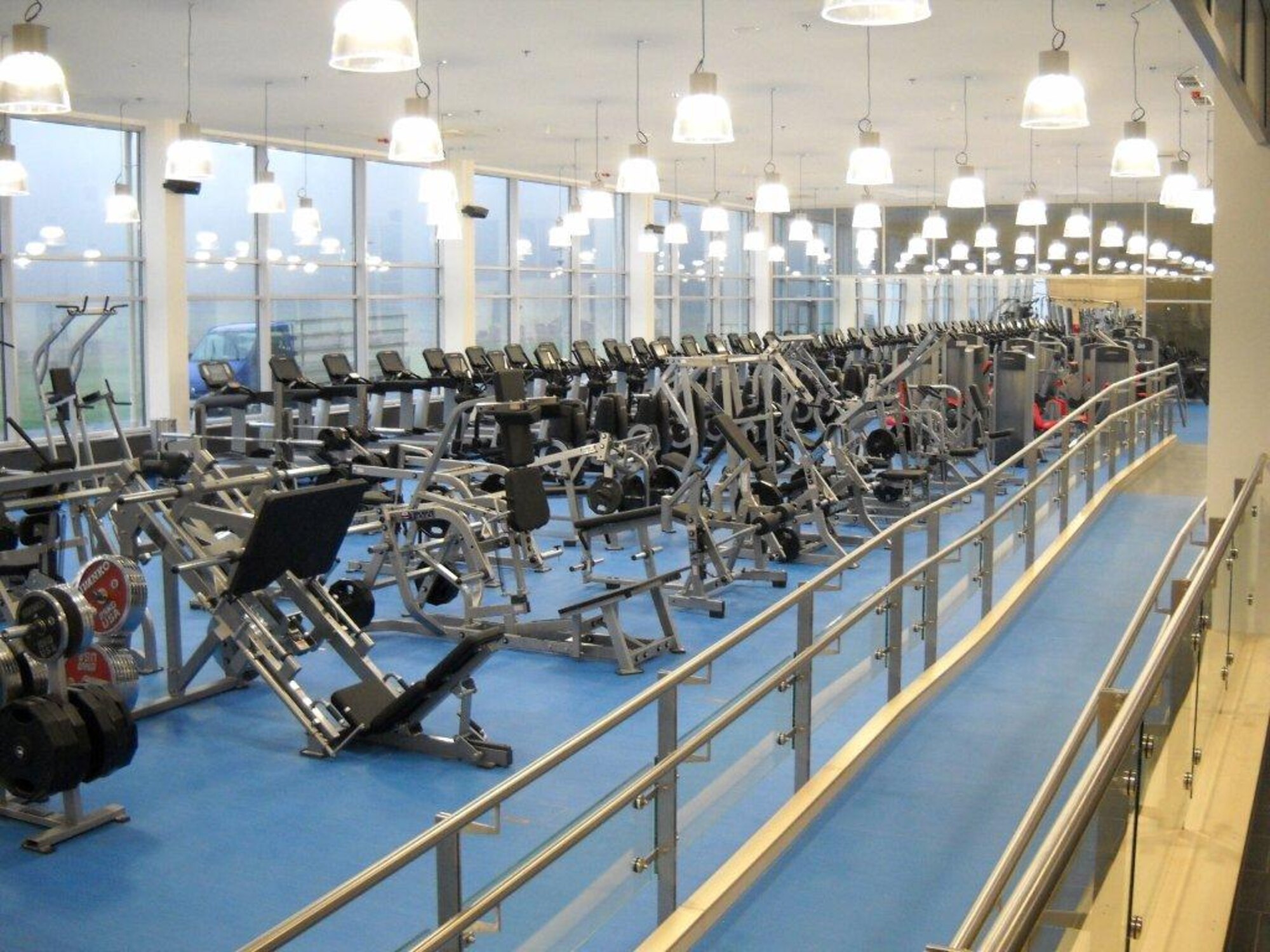 The Air Force Civil Engineer Center recently completed construction of a $20.1 million fitness center at Spangdahlem Air Base, Germany. The fitness center features a gymnasium, indoor running track, cardio and weight rooms, racquetball courts, a climbing wall and a health and wellness center. (U.S. Air Force photo) 
