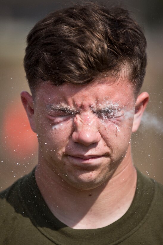 U.S. Navy Hospitalman 3rd Class Micheal Bockover is sprayed with military grade pepper spray while participating in a non-lethal weapons training demonstration during Exercise Cobra Gold 2014 at Samaesan Royal Thai Marine Base, Rayong, Kingdom of Thailand. Cobra Gold, in its 33rd iteration, demonstrates the U.S. and the Kingdom of Thailand's commitment to our long-standing alliance and regional partnership, prosperity and security in the Asia-Pacific region. The demonstration was held by the U.S. Marines of 3rd Platoon, Company A, 3d Law Enforcement Battalion, 3d Marine Division, III Marine Expeditionary Force for the Royal Thai Marines of 1st infantry Battalion.
