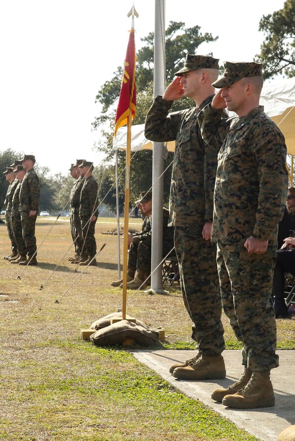 Lieutenant Col. Charles R. Cassidy (right) along with Lt. Col. Timothy R. Powledge both with 3rd Battalion, 2nd Marine Regiment, 2nd Marine Division salute as the unit marches in review during a change of command ceremony where Cassidy turned the command over to Powledge. Powledge took over command and plans to move forward with the unit from where they are and to improve in the areas they can improve in.