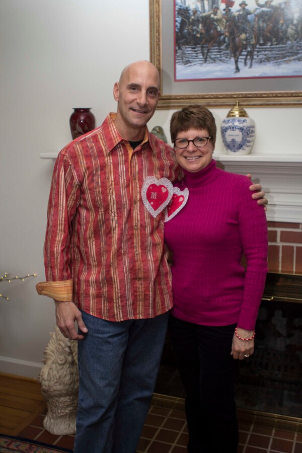 Col. Matthew G. St. Clair, 26th Marine Expeditionary Unit (MEU) commanding officer, poses with his wife Melissa during a get together to recognize efforts of family readiness volunteers, the link between deployed Marines, spouses and children left behind during the 26th MEU's latest deployment, Feb. 7, 2014. (U.S. Marine Corps photo by Cpl. Michael S. Lockett/Released)