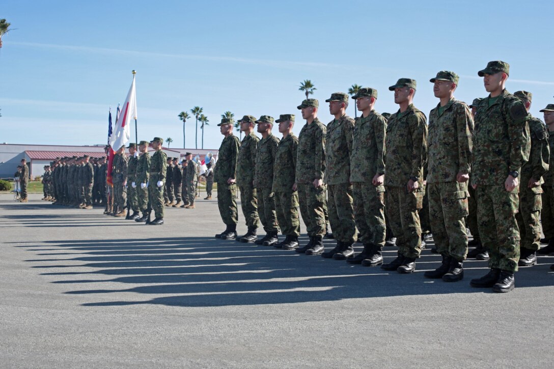 MARINE CORPS BASE CAMP PENDLETON, Calif. - U.S. Marines and Sailors with 13th Marine Expeditionary Unit and members of the Japan Ground Self-Defense Force participate in the opening ceremony of Exercise Iron Fist 2013 aboard Marine Corps Base Camp Pendleton, Calif. Jan. 22, 2013.During Iron Fist 2013, the 13th MEU and Western Army Infantry Regiment, JGSDF will spend three weeks participating in bilateral training to improve their interoperability, enhance military-to-military relations and sharpen skills essential to crisis response. 
(U.S. Marine Corps photo by Gunnery Sgt. Jared Padula/Released)
