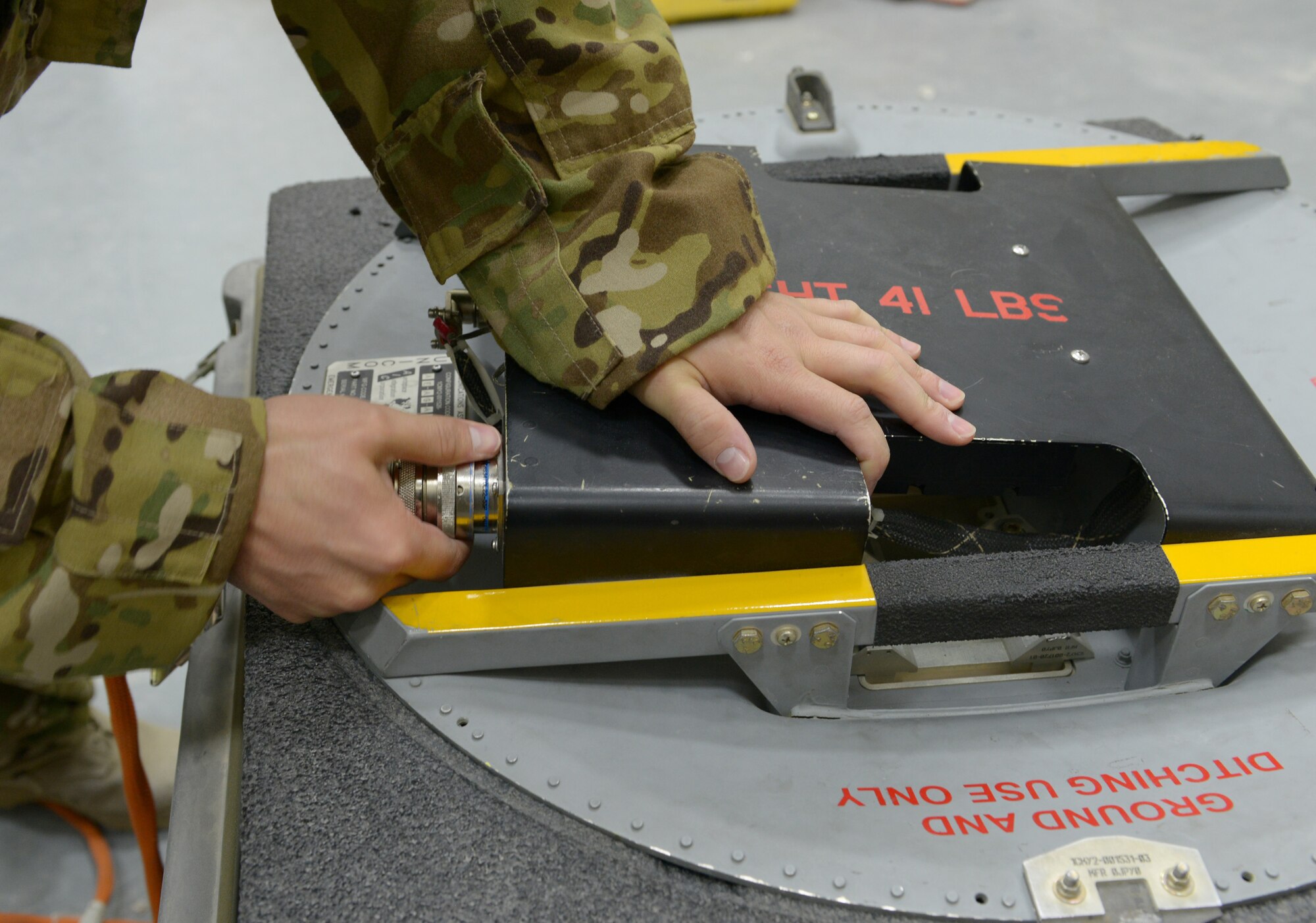 Tech. Sgt. Kevin Fossett connects a cable to an antenna for a pre-mission inspection at Al Udeid Air Base, Qatar, Feb. 12, 2014. The 379th Expeditionary Communications Squadron's Viper Team is made up of six Airmen and on call 24/7 to provide airborne communication throughout the U.S. Air Forces Central Command area of responsibility. Fossett is a 379th ECS Viper team airborne communications specialist deployed from Joint Base Pearl Harbor-Hickam, Hawaii, and a Milford, Conn., native. (U.S. Air Force photo/Senior Airman Hannah Landeros) 