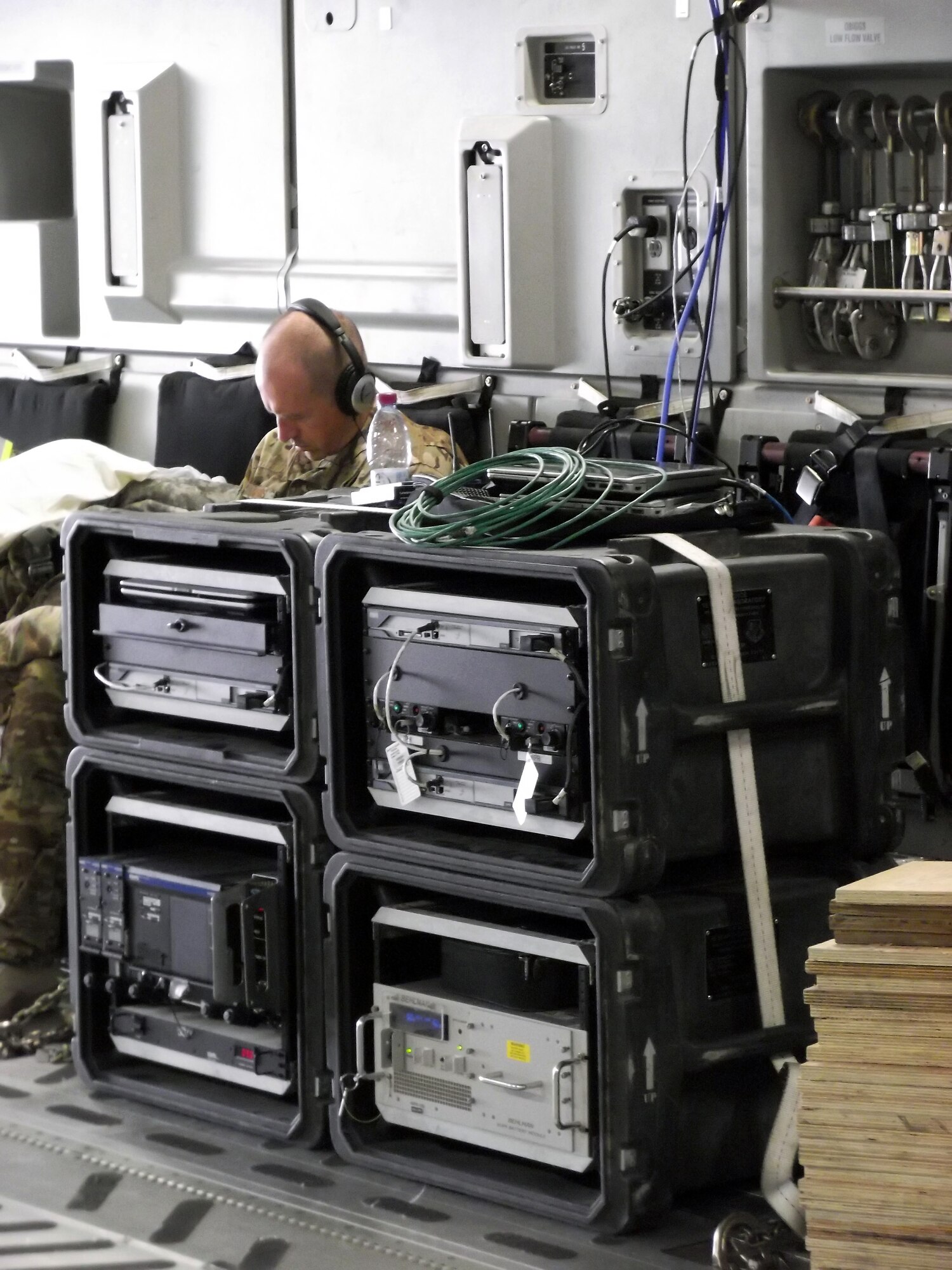 Master Sgt. Robert Higgins sits aboard a C-17 Globemaster III next to a fully operational Viper communications system while in route to a previous missions at Shindand Air Base, Afghanistan. . Higgins is assigned to the 379th ECS Viper Team airborne communication and is serving a one year tour at Al Udeid Air Base, Qatar. The 379th Expeditionary Communications Squadron's Viper Team is made up of six Airmen and on call 24/7 to provide airborne communication throughout the U.S. Air Forces Central Command area of responsibility. (Courtesy photo/Senior Master Sgt. Robert Ross)