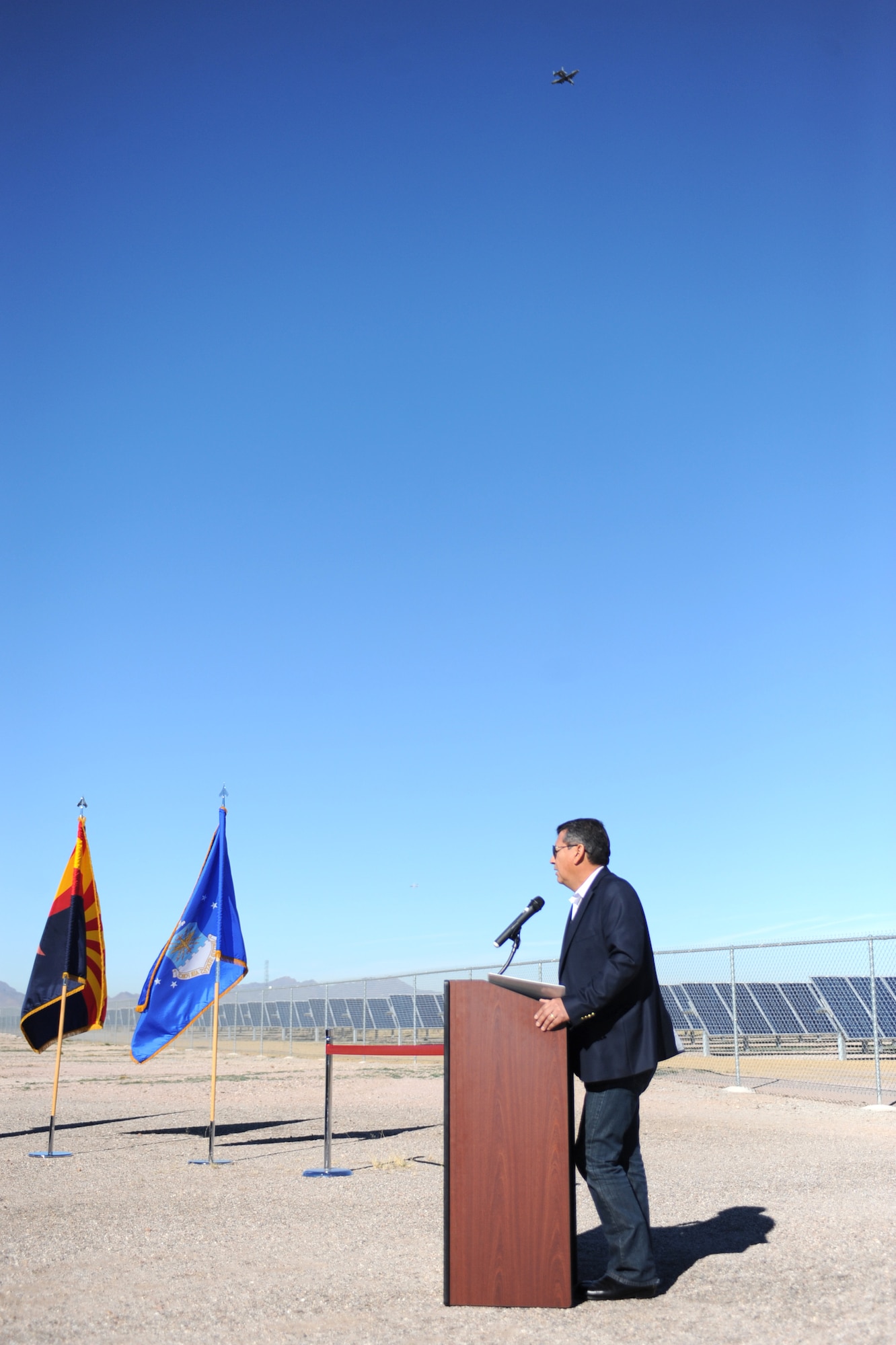 Alex Hinojosa, North American Development Bank deputy managing director, speaks at the photovoltaic solar array ribbon cutting ceremony at Davis-Monthan Air Force Base, Ariz., Feb. 13, 2014.  The 16.4 megawatt solar array is the largest of its kind on any U.S. Department of Defense installation.  (U.S. Air Force Photo by Airman 1st Class Chris Massey/Released)