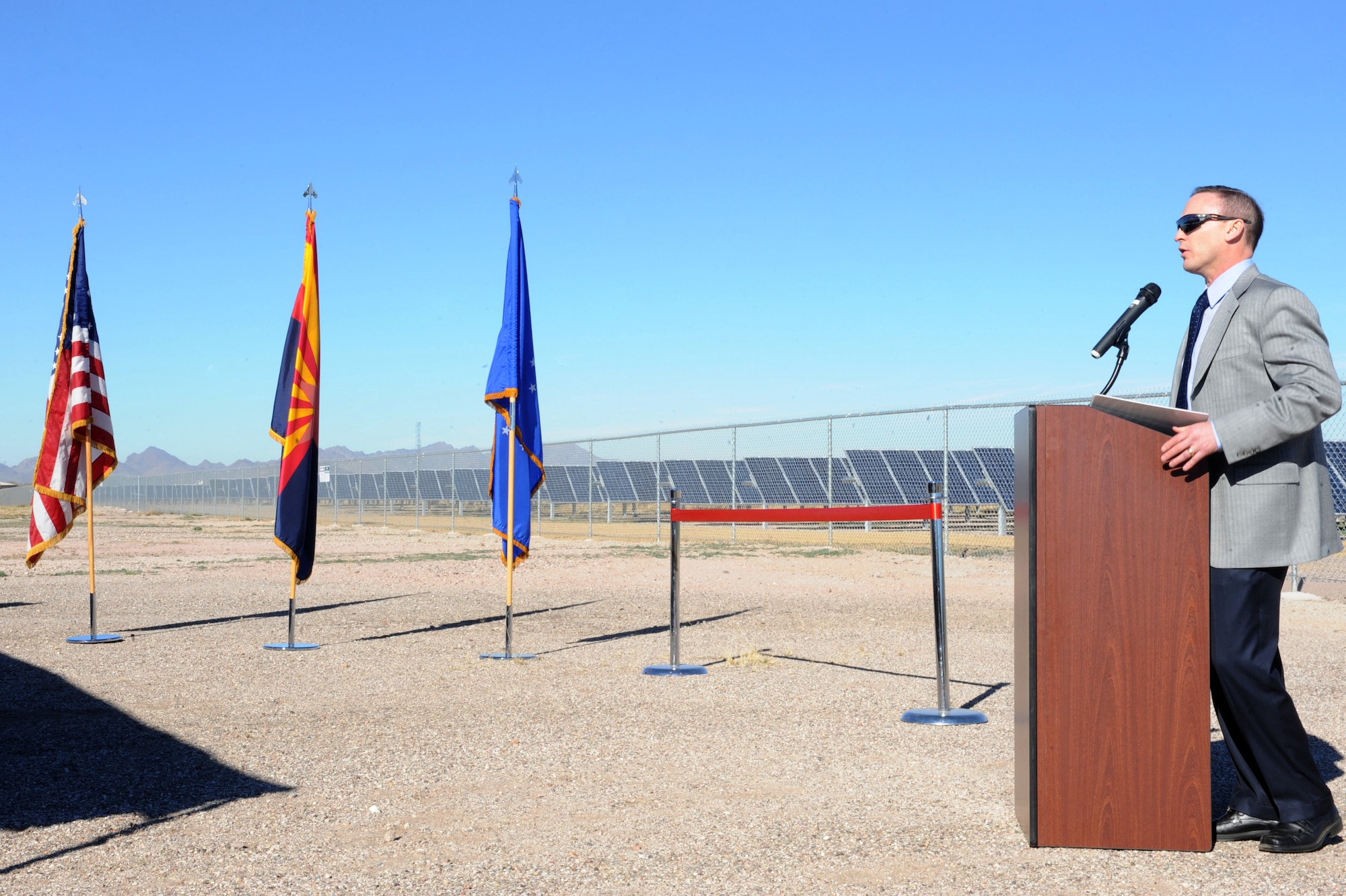 David Hutchens, Tucson Electric Power president, speaks at the photovoltaic solar array ribbon cutting ceremony at Davis-Monthan Air Force Base, Ariz., Feb. 13, 2014.  The Air Force is a significant part of our nation?s strategy to establish greater energy security and become more energy efficient through conservation and use of alternative energy sources.  (U.S. Air Force Photo by Airman 1st Class Chris Massey/Released)