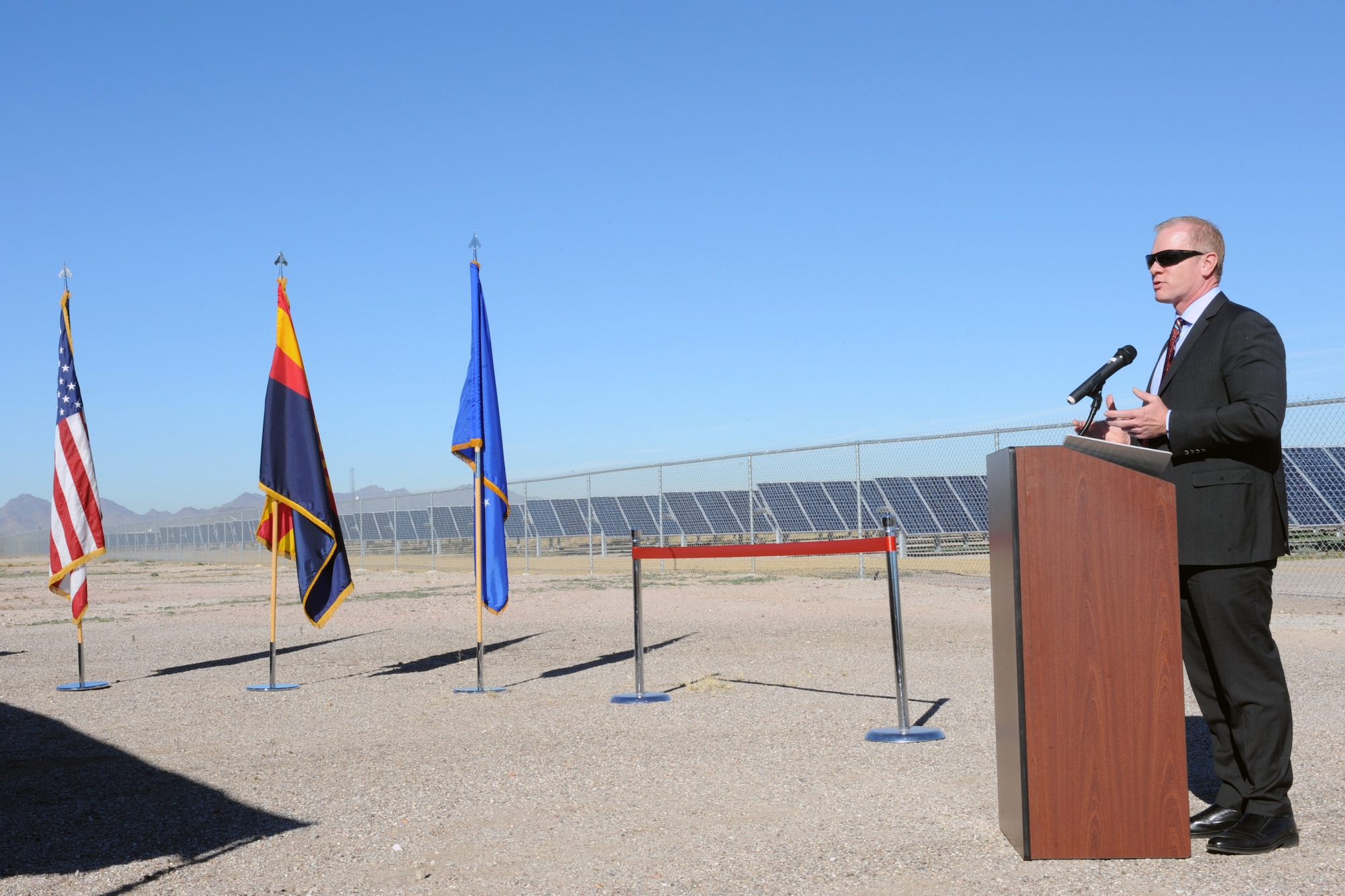 Bob Powell, North America, SunEdison Solar Energy president, speaks at the photovoltaic solar array ribbon cutting ceremony at Davis-Monthan Air Force Base, Ariz., Feb. 13, 2014.  In 2010, Davis-Monthan entered into an agreement with SunEdison, LLC to design, finance, build, operate and maintain the array on 170 acres of underutilized land at two locations on base.  (U.S. Air Force Photo by Airman 1st Class Chris Massey/Released)