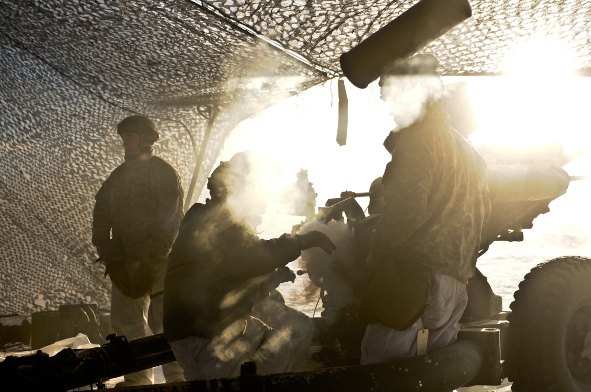 A paratrooper with A Battery, 2nd Battalion, 377th Parachute Field Artillery Regiment, throws an expended 105-mm howitzer shell during a live-fire exercise at JBER Jan. 31. The Spartan Brigade used the training opportunity to further validate its readiness as the Army’s only airborne brigade in the Asia-Pacific Theater. (U.S. Army photo/Sgt. Eric-James Estrada)