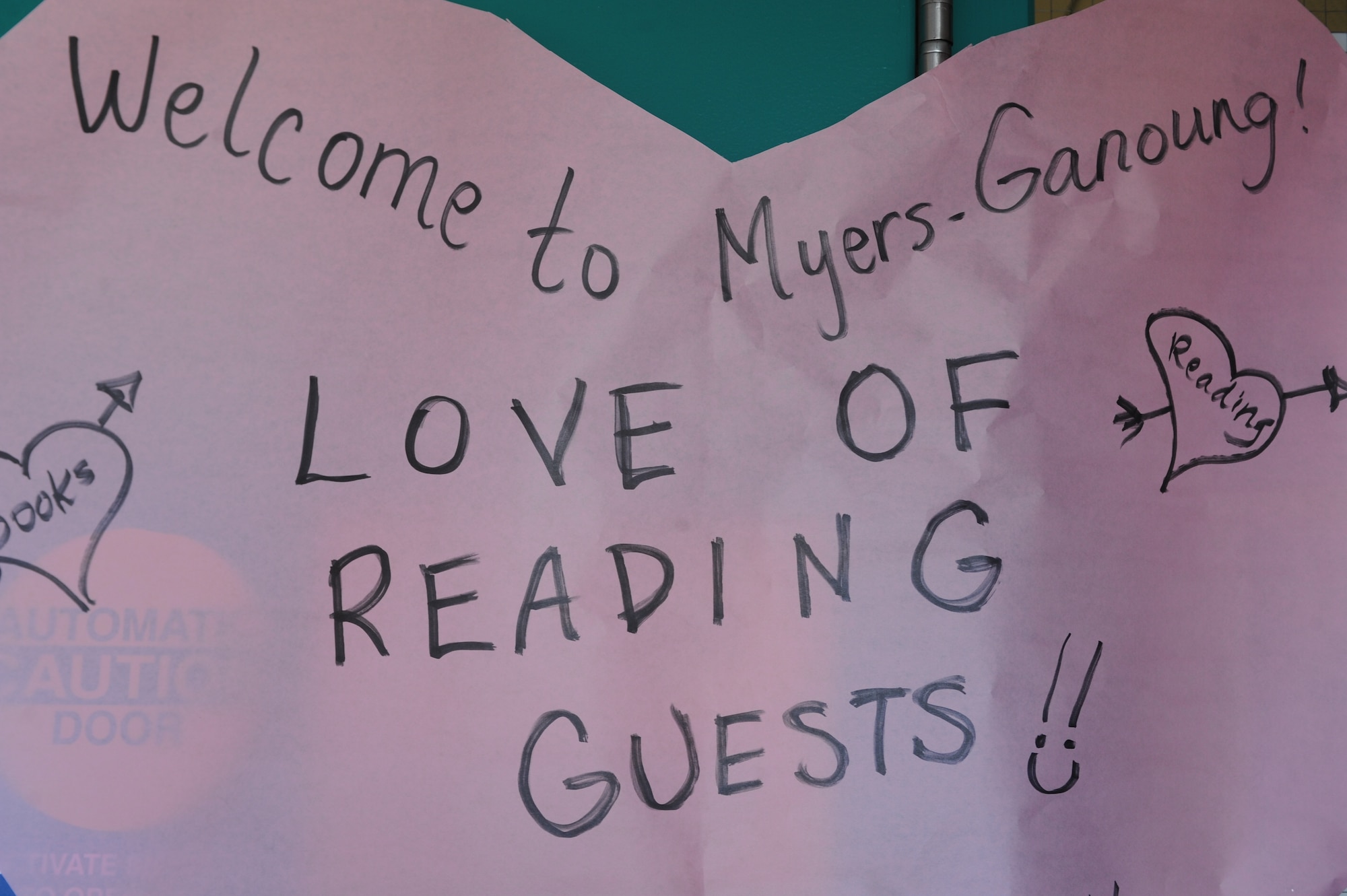 A welcome sign hangs on the door leading into Myers-Ganoung Elementary School greeting Love of Reading Week guests in Tucson, Ariz., Feb. 12, 2014. Community members volunteered their time throughout the week to read to students, promoting literacy and the importance of reading. (U.S. Air Force photo by Airman 1st Class Cheyenne Morigeau/ Released)