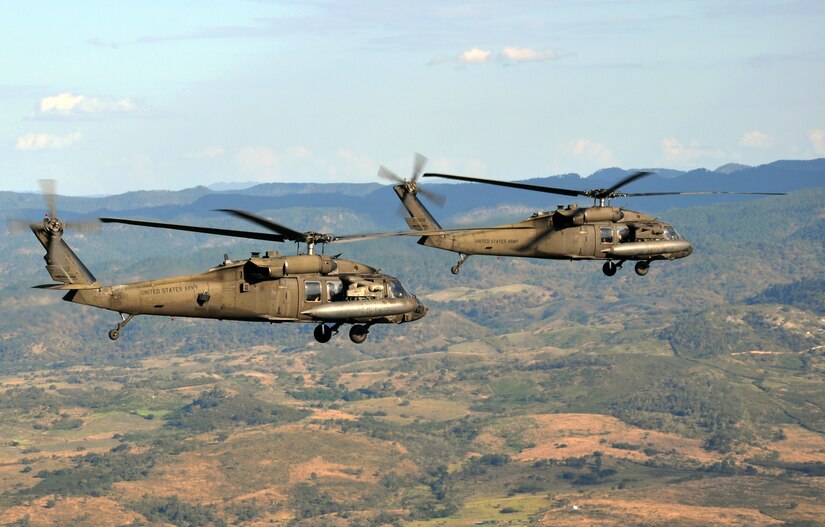 A pair of UH-60 Blackhawk helicopters assigned to Joint Task Force-Bravo's 1-228th Aviation Regiement cruise over the Honduran landscape, Feb. 12, 2014. The two aircraft were transporting a delegation of several U.S. and Honduran distinguished visitors, including U.S. Marine Corps. Gen. John F. Kelly, Commander, U.S. Southern Command, and U.S. Ambassador to Honduras Lisa Kubiske, to visits to multiple Honduran military installations throughout the country. (U.S. Air Force photo by Capt. Zach Anderson)