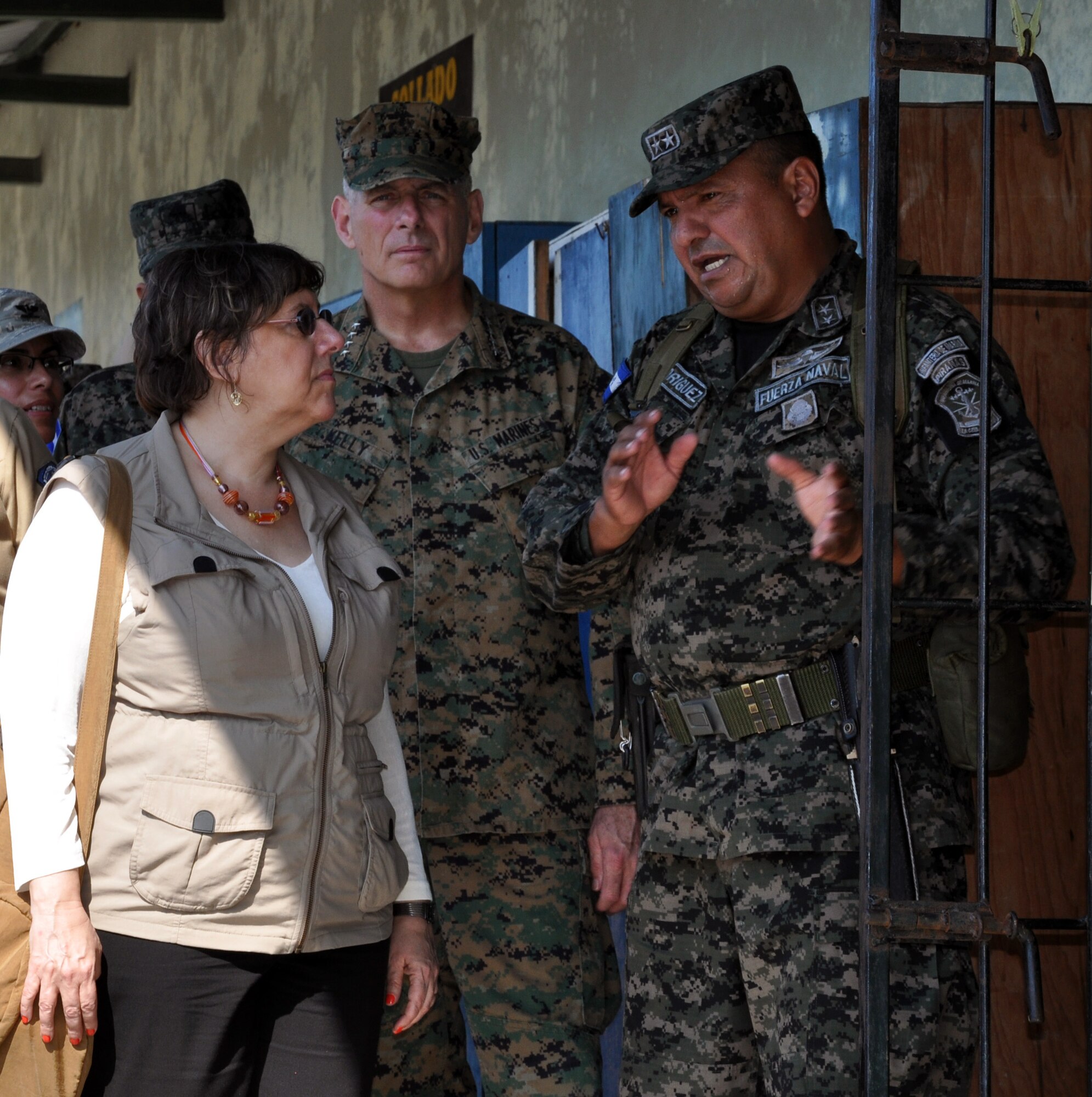 U.S. Marine Corps Gen. John F. Kelly, Commander, U.S. Southern Command, and U.S. Ambassador to Honduras Lisa Kubiske, visit with a Honduran military member while touring Honduran marine base at La Ceiba, Honduras, Feb. 12, 2014.  Kelly and a delegation of U.S. Department of State and U.S. and Honduran military leaders, including Kubiske, Honduran Maj. Gen. Fredy Diaz, Joint Chief of the Honduran Military, and Honduran Rear Admiral Hector Caballero, Honduran Navy Commander, spent the day visiting several Honduran military facilities. Throughout the day, the delegation received briefings and had the opportunity to discuss issues with Honduran military leadership. Transportation for the day was provided by UH-60 Blackhawk helicopters from Joint Task Force-Bravo's 1-228th Aviation Regiment. (U.S. Air Force photos by Capt. Zach Anderson)