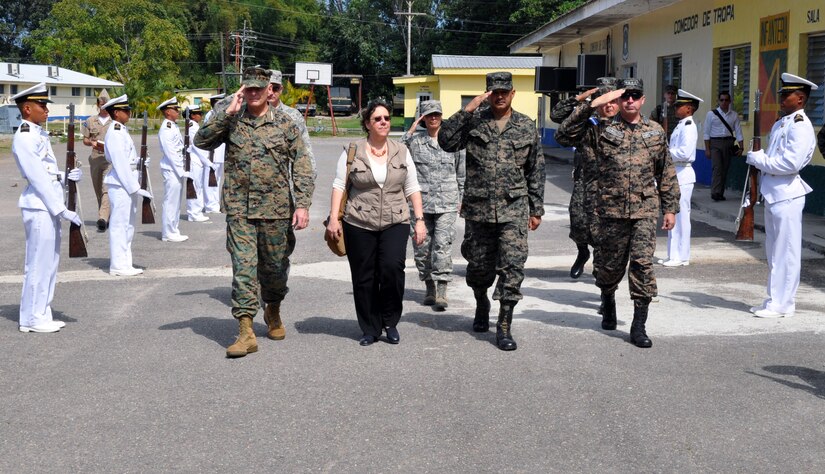 U.S. Marine Corps Gen. John F. Kelly, Commander, U.S. Southern Command, U.S. Ambassador to Honduras Lisa Kubiske, Honduran Maj. Gen. Fredy Diaz, Joint Chief of the Honduran Military, and Honduran Rear Admiral Hector Caballero, Honduran Navy Commander, are greeted by an honor guard upon their arrival at the Honduran Naval Academy at La Ceiba, Honduras, Feb. 12, 2014. Kelly and Kubiske, along with a delegation of U.S. Department of State and U.S. and Honduran military leaders, spent the day visiting several Honduran military installations throughout the country. Transportation was provided by UH-60 Blackhawks from Joint Task Force-Bravo's 1-228th Aviation Regiment. (U.S. Air Force photo by Capt. Zach Anderson)