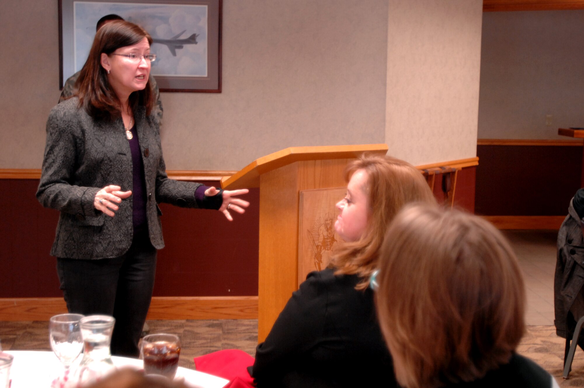 Ricki Selva briefs a group of Key Spouses, mentors and first sergeants at the Northern Lights Club Warrior Lounge Feb. 11, 2014. Mrs. Selva, one of the first women to ever graduate from the Air Force Academy in the class of 1980, focused her visit on the families’ perspective of military service, dignity and respect in the ranks and force restructuring. Air Mobility Command Commander Gen. Paul Selva, Mrs. Selva, and AMC Command Chief Master Sgt. Victoria Gamble spent Feb. 11 and 12 here, getting to know the Airmen and families of Grand Forks Air Force Base. (U.S. Air Force photo/Staff Sgt. Susan L. Davis)