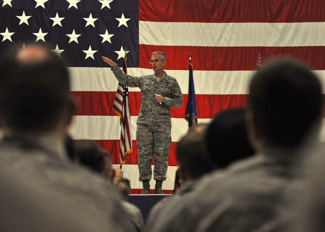 Gen. Paul Selva, Air Mobility Command commander, speaks about current initiatives designed to “right-size” the Air Force during a speech to Airmen on Feb. 12, 2014, on Grand Forks Air Force Base, N.D. Selva also spoke about his three priorities: mission, dignity and respect, and training. (U.S. Air Force photo/Senior Airman Xavier Navarro) 