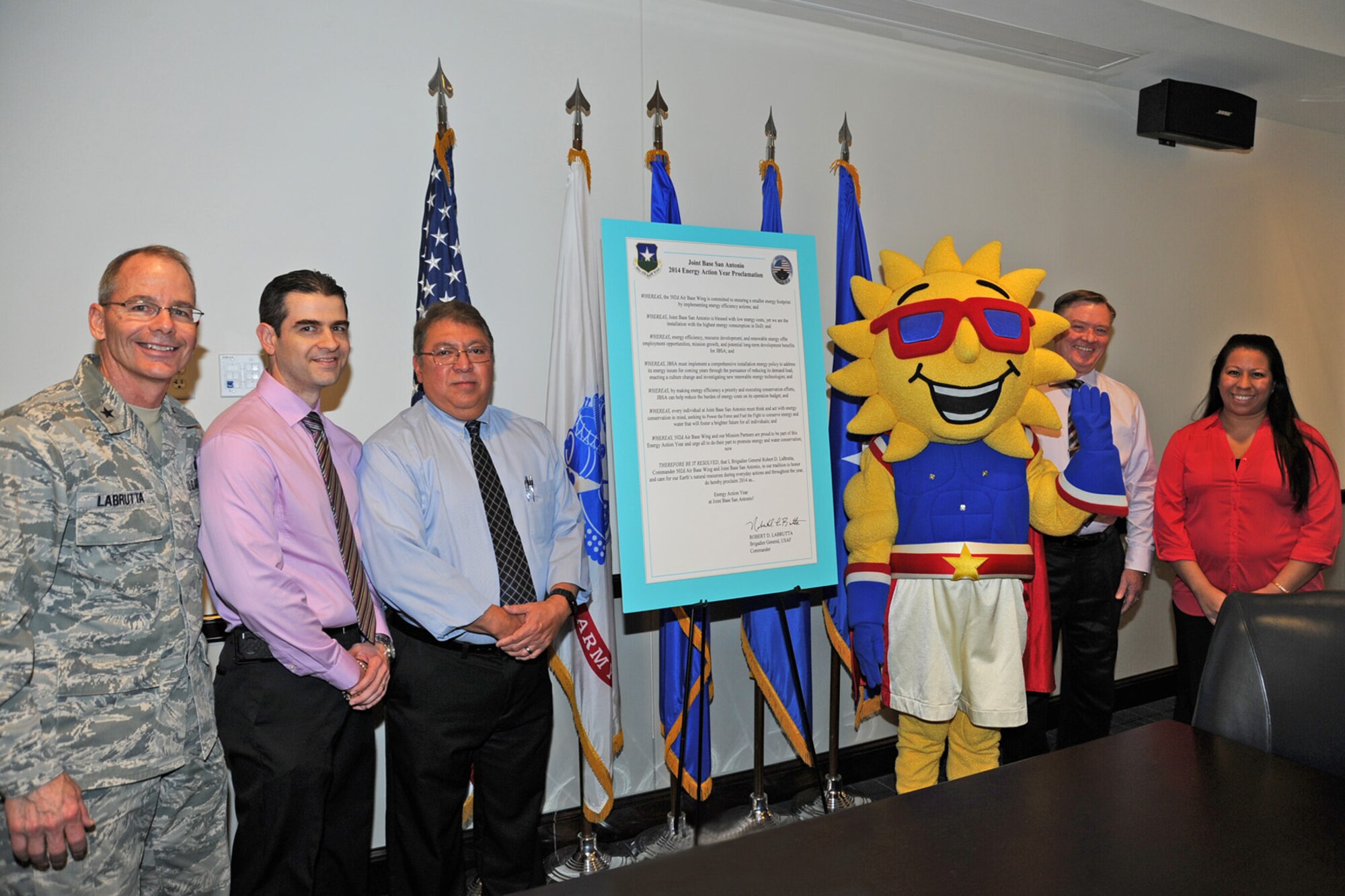 Brig. Gen. Bob LaBrutta (left), 502nd Air Base Wing and Joint Base San Antonio commander, signed a proclamation that designates 2014 as an Energy Action Year in JBSA during a ceremony Feb. 6 at JBSA-Fort Sam Houston. Representing the JBSA energy team at the signing were Ruben Ramos (second from left), JBSA-Randolph energy manager; Andy Hinojosa, JBSA-Lackland energy manager; Ray, the JBSA energy mascot; James Wimberley, JBSA chief of portfolio optimization; and Lauriebeth Smith, JBSA energy manager section chief. (U.S. Air Force Photo by Olivia Mendoza/Released)