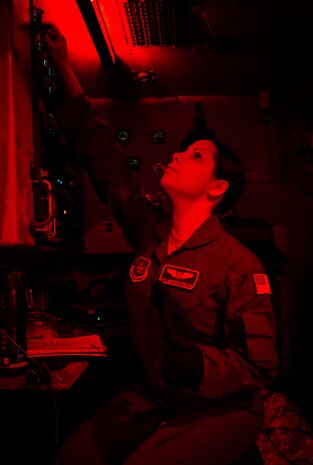 Airman 1st Class Amanda Fields, 17th Airlift Squadron loadmaster, performs a pre-flight inspection Feb. 11, 2014, at Joint Base Charleston – Air Base, S.C. When deployed, the 17th AS will fly multiple missions every day, moving either cargo or personnel. The majority of their missions will be air drops … dropping critical supplies, such as food and ammunition to forward operating bases. (U.S. Air Force photo/Senior Airman Ashlee Galloway)