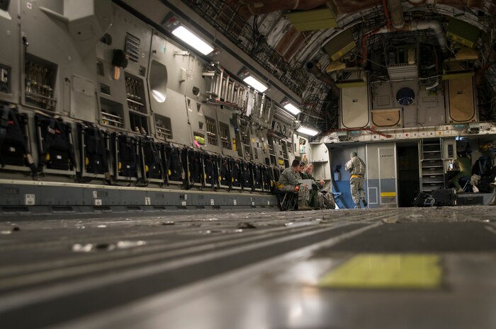 17th Airlift Squadron personnel prepare for a flight Feb. 11, 2014, at Joint Base Charleston – Air Base, S.C. When deployed, the 17th AS will fly multiple missions every day, moving either cargo or personnel. The majority of their missions will be air drops … dropping critical supplies, such as food and ammunition to forward operating bases. (U.S. Air Force photo/Senior Airman Ashlee Galloway)