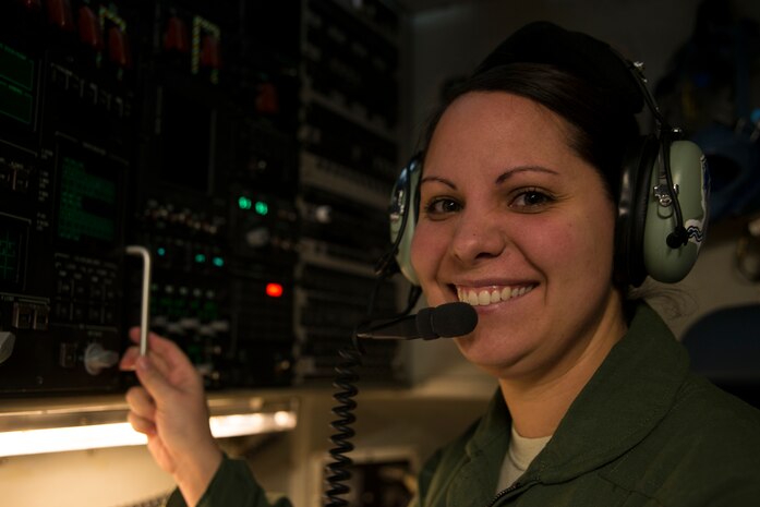 Airman 1st Class Amanda Fields, 17th Airlift Squadron loadmaster, performs a pre-flight inspection Feb. 11, 2014, at Joint Base Charleston – Air Base, S.C. When deployed, the 17th AS will fly multiple missions every day, moving either cargo or personnel. The majority of their missions will be air drops … dropping critical supplies, such as food and ammunition to forward operating bases. (U.S. Air Force photo/Senior Airman Ashlee Galloway)