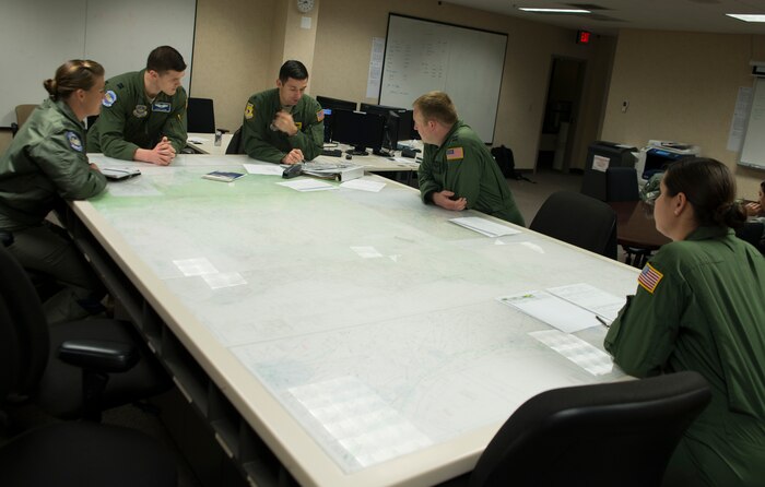 Col. Doug Soho, 437th Operations Group chief of standards and evaluations, gives a pre-flight brief to members of the 17th Airlift Squadron Feb. 11, 2014, at Joint Base Charleston – Air Base, S.C. When deployed, the 17th AS will fly multiple missions every day, moving either cargo or personnel. The majority of their missions will be air drops … dropping critical supplies, such as food and ammunition to forward operating bases. (U.S. Air Force photo/Senior Airman Ashlee Galloway)