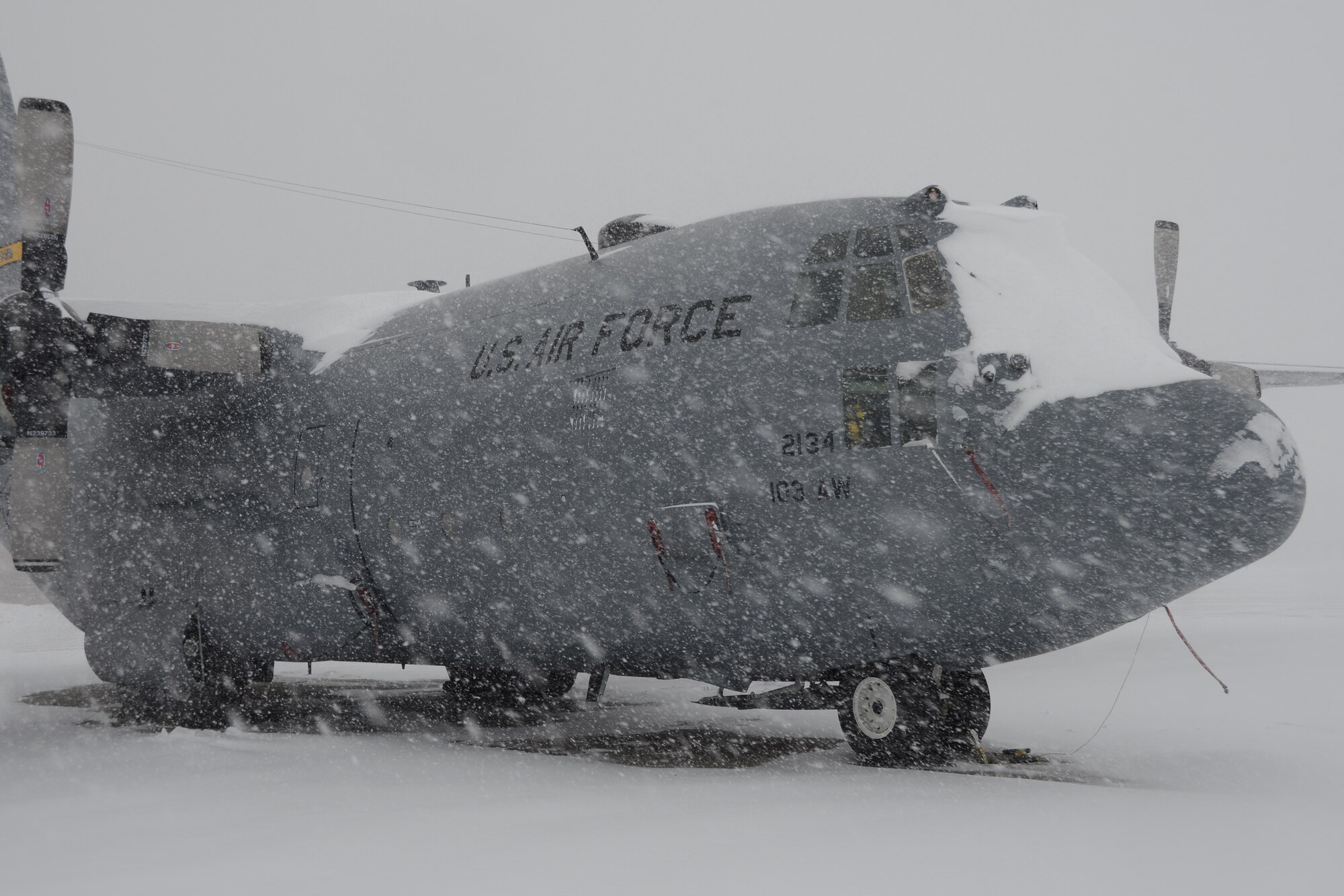 Snow rapidly accumulates on a C-130H aircraft assigned to the 103rd Airlift Wing during a nor’easter at Bradley Air National Guard Base, East Granby, Conn., Feb. 13, 2014. More than 200 Airmen reported to work here and at the Orange Air National Guard Station, ready to answer the call in the event the state required assistance during the height of the storm.  (U.S. Air National Guard photo by Maj. Bryon M. Turner)