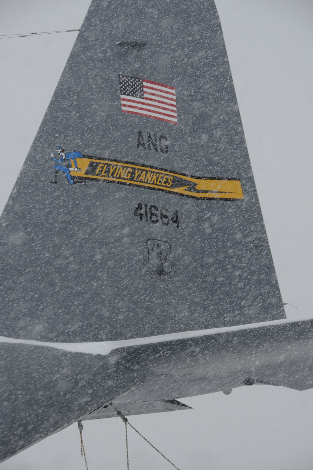 Snow rapidly accumulates on a C-130H aircraft assigned to the 103rd Airlift Wing during a nor’easter at Bradley Air National Guard Base, East Granby, Conn., Feb. 13, 2014. More than 200 Airmen reported to work here and at the Orange Air National Guard Station, ready to answer the call in the event the state required assistance during the height of the storm.  (U.S. Air National Guard photo by Maj. Bryon M. Turner)