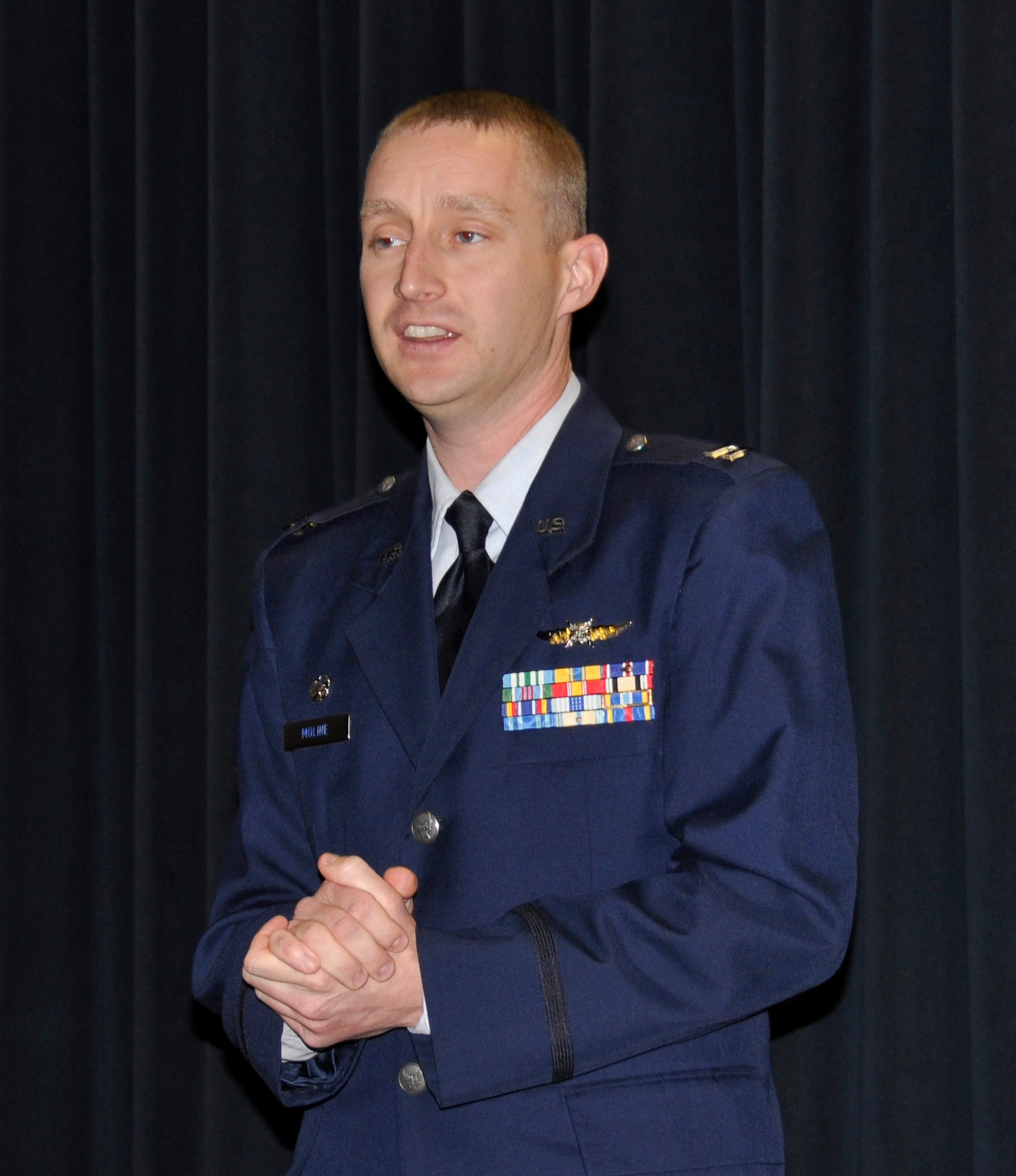 Capt. Daniel Moline addresses the crowd after becoming the 302nd communications flight commander. Moline has been a member of the 302nd Airlift Wing since 2007. (U.S. Air Force photo/Master Sgt. Daniel Butterfield)