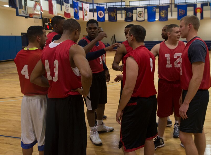 723d Aircraft Maintenance Squadron basketball team assembles during a timeout during an intramural basketball game at Moody Air Force Base, Ga., Feb. 12, 2014. After the timeout, 723d AMXS extends their lead to 22-16. (U.S. Air Force photo by Airman Dillian Bamman/Released)