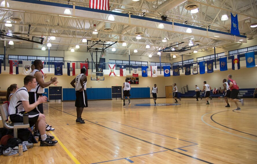 23d Equipment Maintenance Squadron and 723d Aircraft Maintenance Squadron face off in an intramural basketball game at Moody Air Force Base, Ga., Feb. 12, 2014. Successful teams in the season have a chance to play for the intramural basketball championship in March 2014. (U.S. Air Force photo by Airman Dillian Bamman/Released)