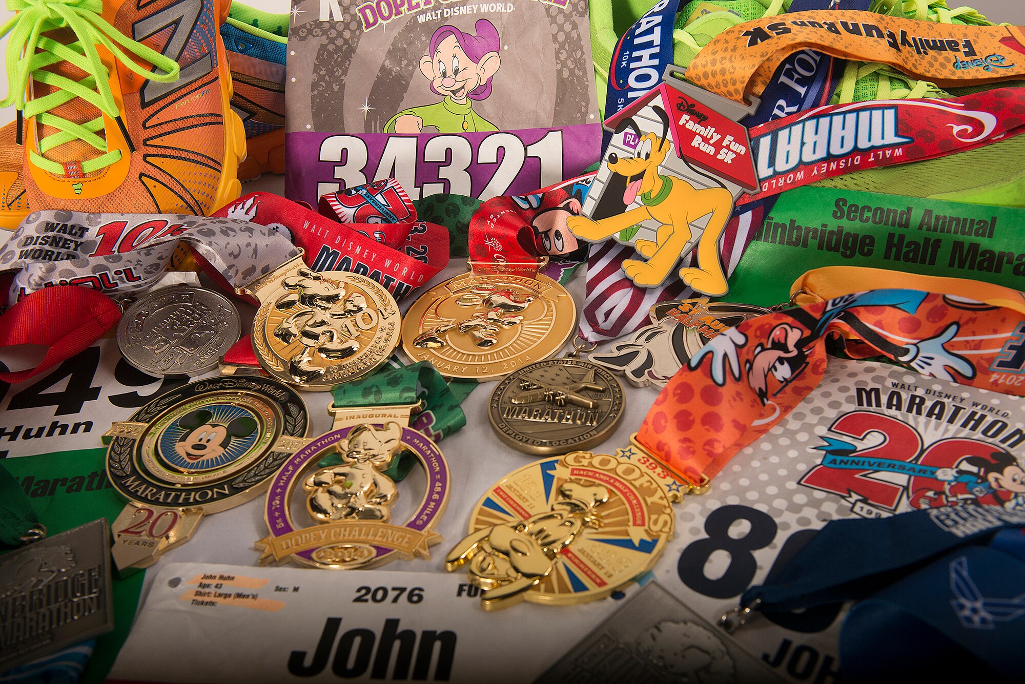 Medals, marathon tags and the shoes belonging to U.S. Air Force Chief Master Sgt. John Huhn, 723d Aircraft Maintenance Squadron superintendent, lay out on display at Moody Air Force Base, Ga., Feb. 12, 2014. With three half marathons and three full marathons under his belt so far, Huhn hopes to one day qualify for the Boston Marathon. (U.S. Air Force photo by Senior Airman Tiffany M. Grigg)  

 
