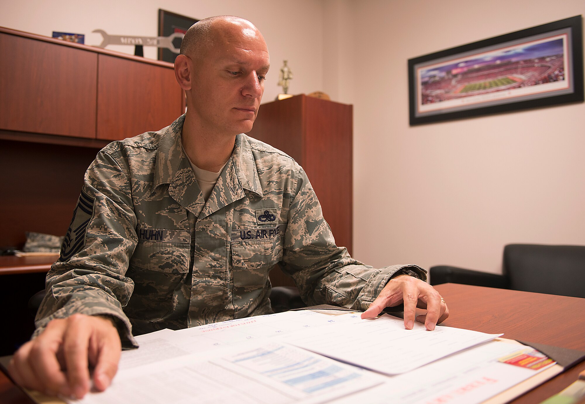 U.S. Air Force Chief Master Sgt. John Huhn, 723d Aircraft Maintenance Squadron superintendent, reviews management internal control toolset checklists at Moody Air Force Base, Ga., Feb. 11, 2014. In his off-duty time, Huhn participates in half and full marathons to keep in shape and serve as inspiration to his fellow Airmen. (U.S. Air Force photo by Senior Airman Tiffany M. Grigg/Released) 