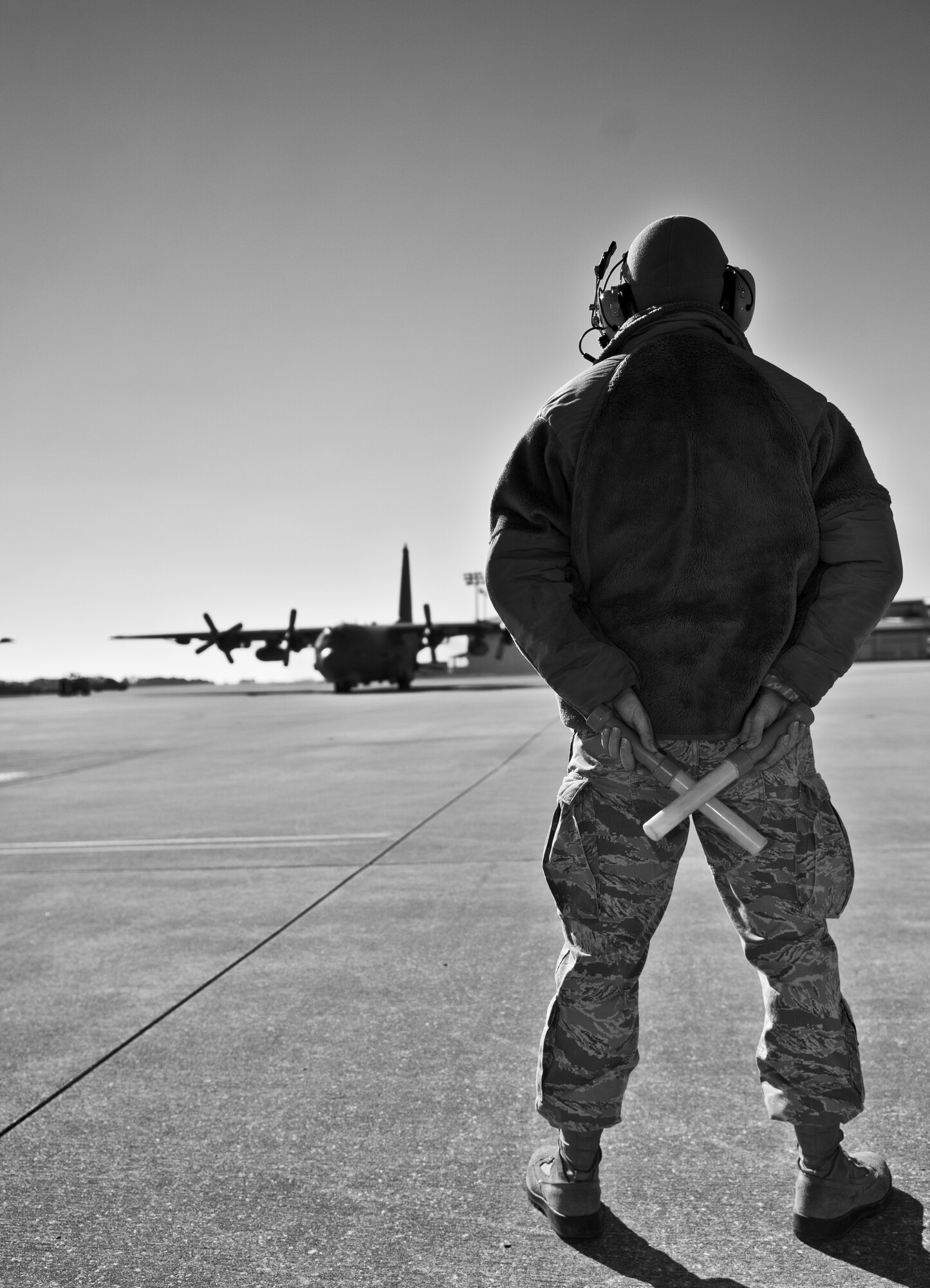 Airman 1st Class Christopher Aubuchon, 1st Special Operations Aircraft Maintenance Squadron crew chief, prepares to marshal an AC-130 on the flightline at Hurlburt Field, Fla., Feb. 7, 2014. Crew chiefs learn to marshal aircraft during technical school. (U.S. Air Force photo/Senior Airman Krystal M. Garrett)  