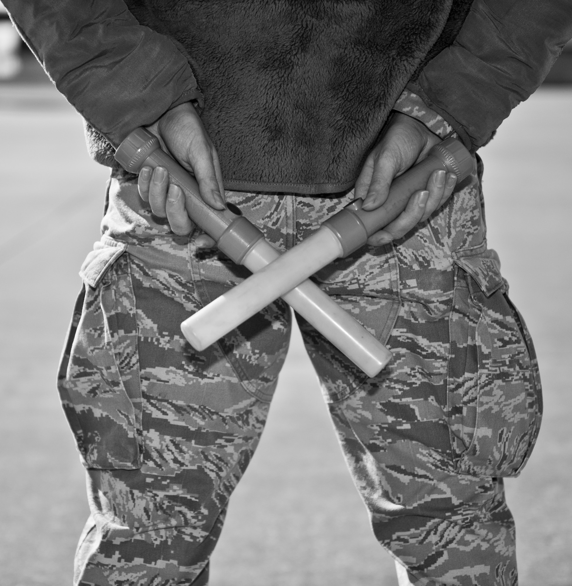 Airman 1st Class Christopher Aubuchon, 1st Special Operations Aircraft Maintenance Squadron crew chief, prepares to marshal an AC-130 on the flightline at Hurlburt Field, Fla., Feb. 7, 2014. Marshaling aircraft helps pilots get aircraft off the ground safely. (U.S. Air Force photo/Senior Airman Krystal M. Garrett)  