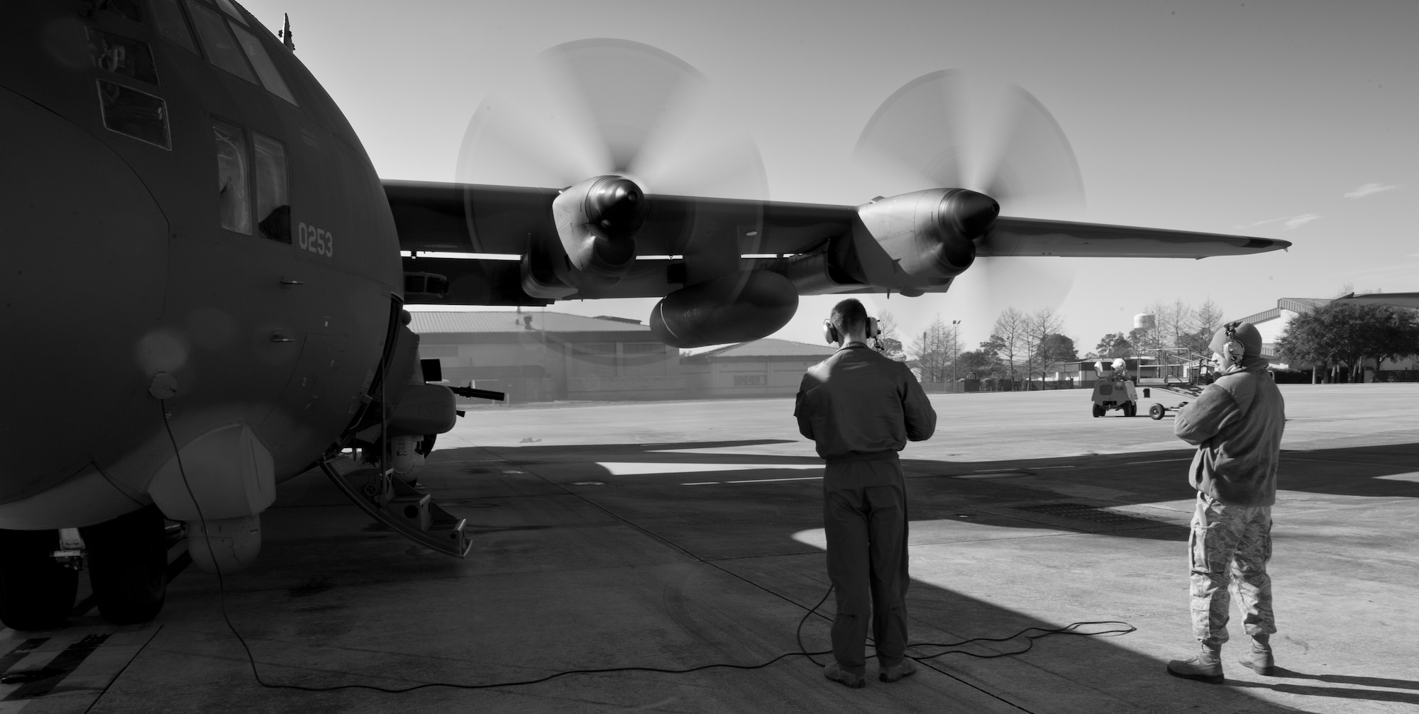 Senior Airman Clinton Coykendall, 4th Special Operation Squadron special missions aviator, and Airman 1st Class Christopher Aubuchon, 1st Special Operations Aircraft Maintenance Squadron crew chief, go through an engine start check list on the flightline at Hurlburt Field, Fla., Feb. 7, 2014. Coykendall went through the engine start checklist to reduce the chances of an engine catching fire prior to launch. (U.S. Air Force photo/Senior Airman Krystal M. Garrett) 