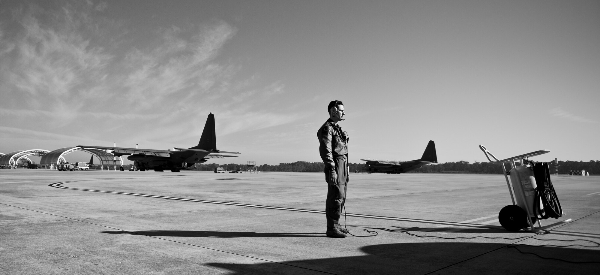 Senior Airman Clinton Coykendall, 4th Special Operations Squadron special missions aviator, awaits an engine start check for an AC-130 on the flightline at Hurlburt Field, Fla., Feb. 7, 2014. Coykendall ensured the engine start was successful before he boarded the aircraft. (U.S. Air Force photo/Senior Airman Krystal M. Garrett) 