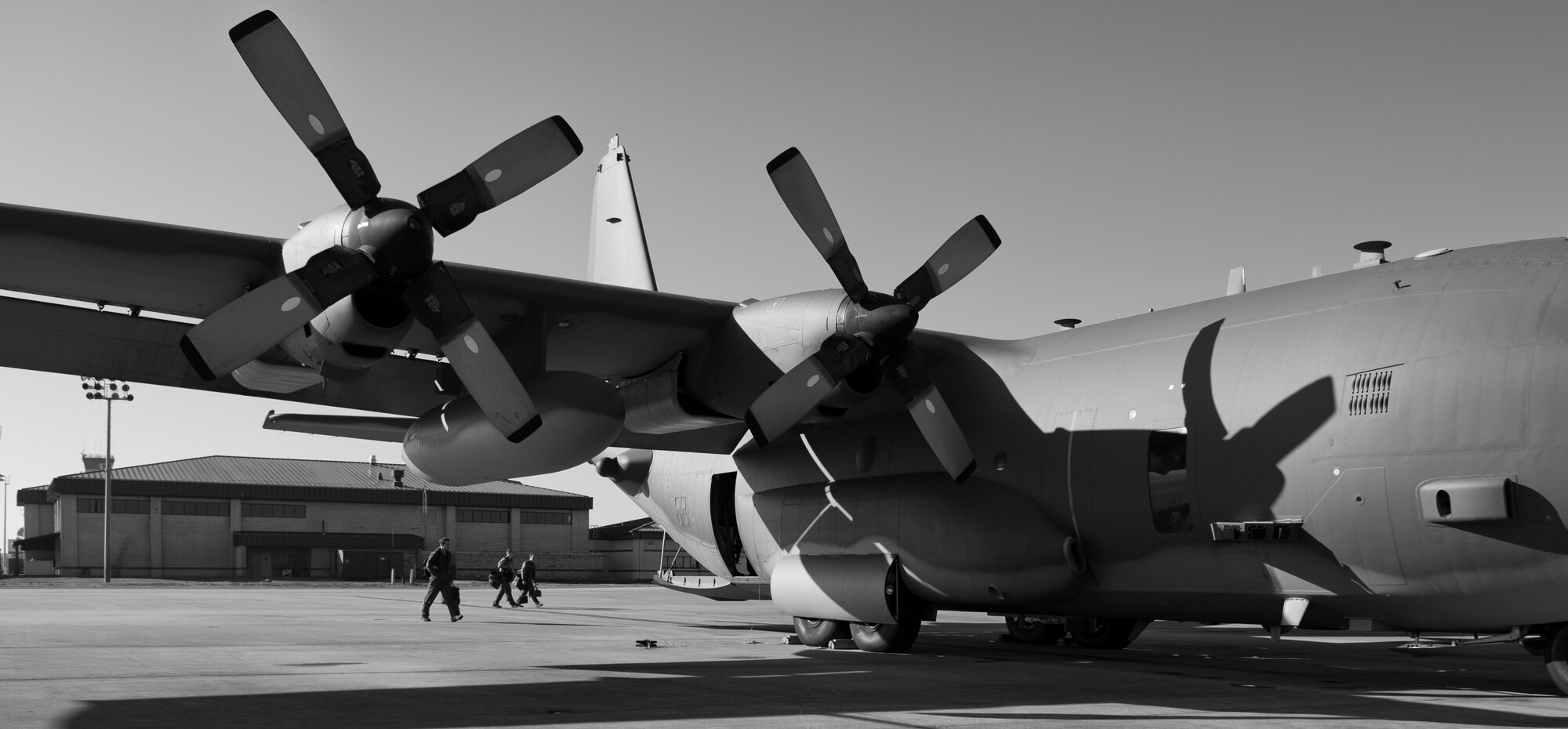 Aircrew members from the 4th Special Operations Squadron walk toward an AC-130 on the flightline at Hurlburt Field, Fla., Feb. 7, 2014. Pilots from the 4th SOS performed proficiency training during the flight. (U.S. Air Force photo/Senior Airman Krystal M. Garrett) 