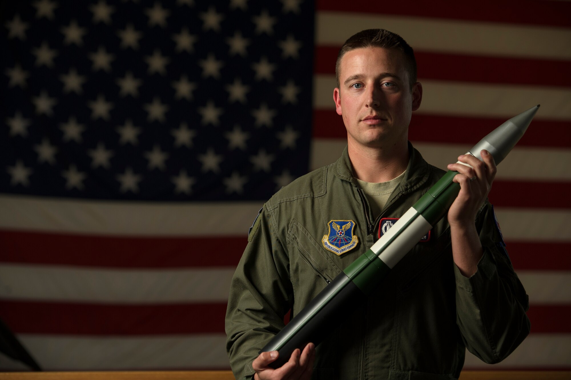 Capt. Erik Holmstrom, 576th Flight Test Squadron missileer, displays a model of a Minuteman III at Vandenberg Air Force Base, Calif., Feb. 3, 2014. The 576th FLTS is America's only Intercontinental Ballistic Missile training and testing squadron that conducts an average of 3-4 test launches each year. (U.S. Air Force photo by Staff Sgt. Jonathan Snyder/RELEASED)
