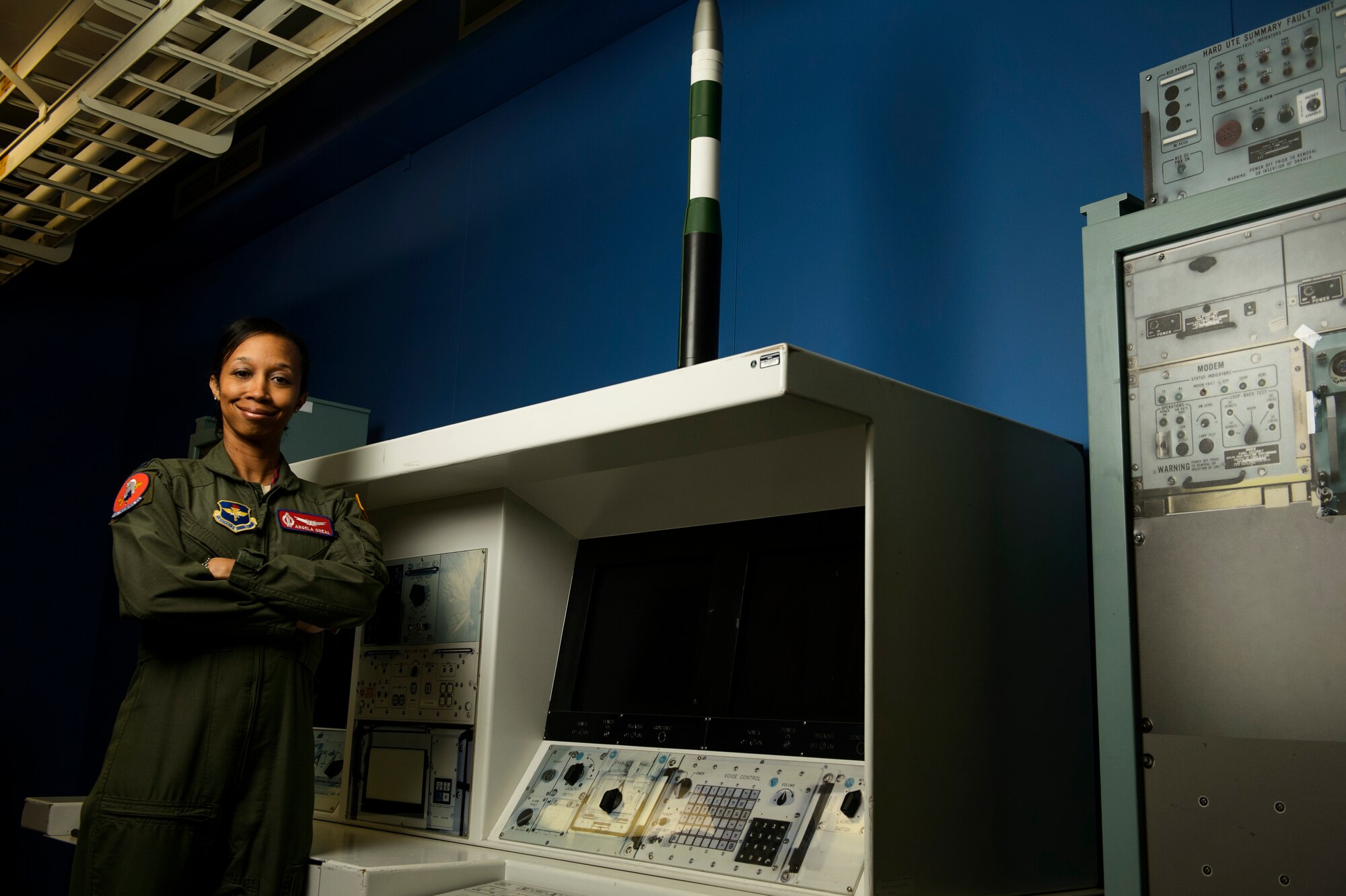 Capt. Angela O'Neal, 532nd Training Squadron Intercontinental Ballistic Missile instructor supervisor, poses for a photo in a missile procedure trainer room at Vandenberg Air Force Base, Calif., Feb. 4, 2014. The 532nd TRS train and educate more than 180 missileer graduates every year. (U.S. Air Force photo by Staff Sgt. Jonathan Snyder/RELEASED)
