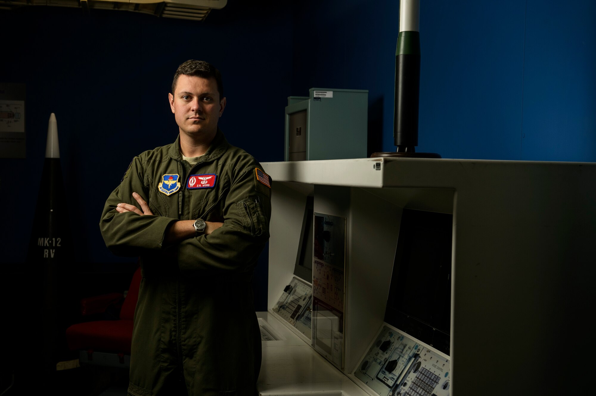 Capt. Zack Word, 532nd Training Squadron Intercontinental Ballistic Missile operations instructor, poses for a photo in a missile procedure trainer room at Vandenberg Air Force Base, Calif., Feb. 4, 2014. The 532nd TRS train and educate more than 180 missileer graduates every year. (U.S. Air Force photo by Staff Sgt. Jonathan Snyder/RELEASED)
