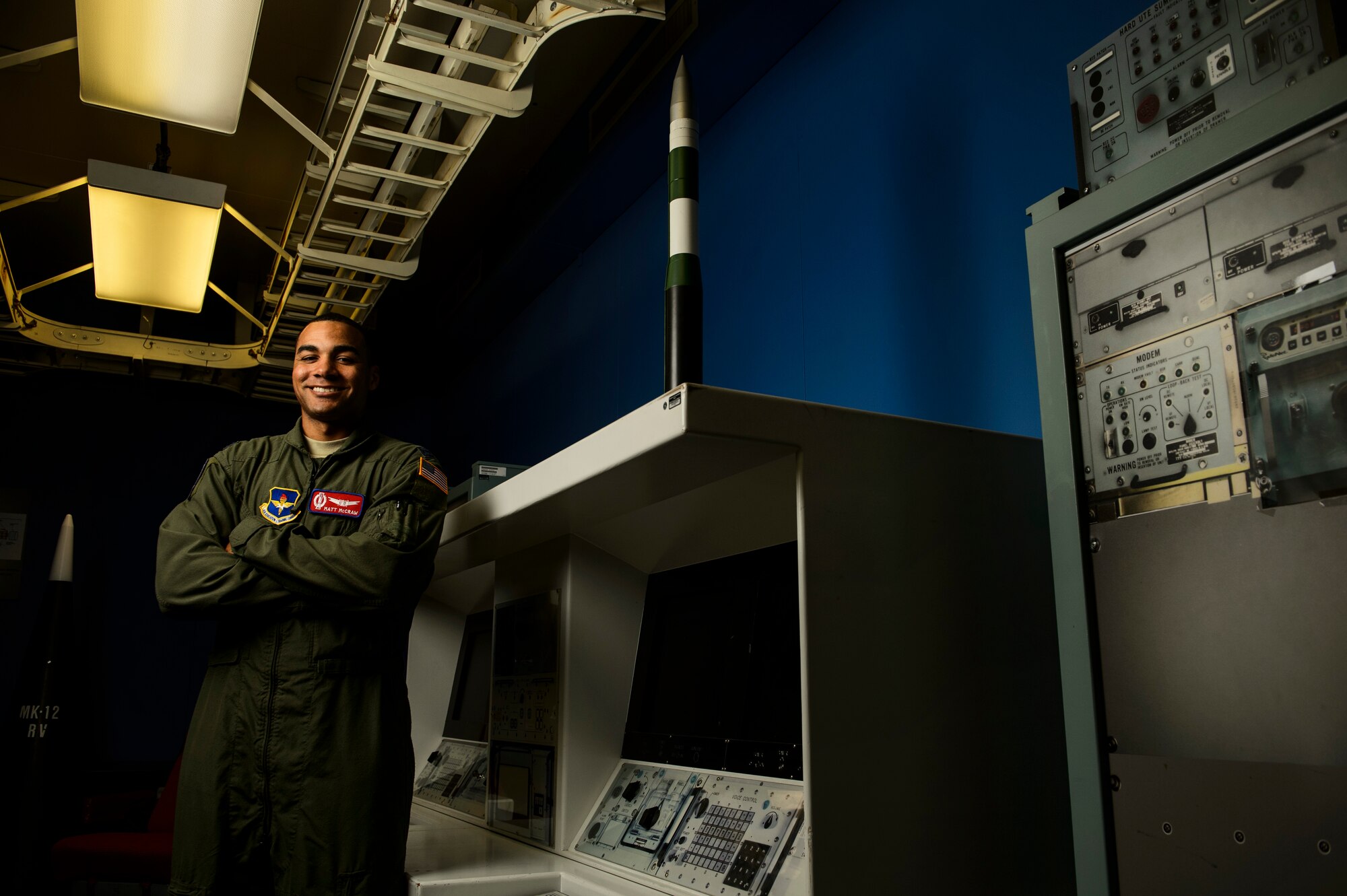 Capt. Matthew McCraw, 532nd Training Squadron Intercontinental Ballistic Missile electronic weapons officer operations instructor, poses for a photo in a missile procedure trainer room at Vandenberg Air Force Base, Calif., Feb. 4, 2014. The 532nd TRS train and educate more than 180 missileer graduates every year. (U.S. Air Force photo by Staff Sgt. Jonathan Snyder/RELEASED)

