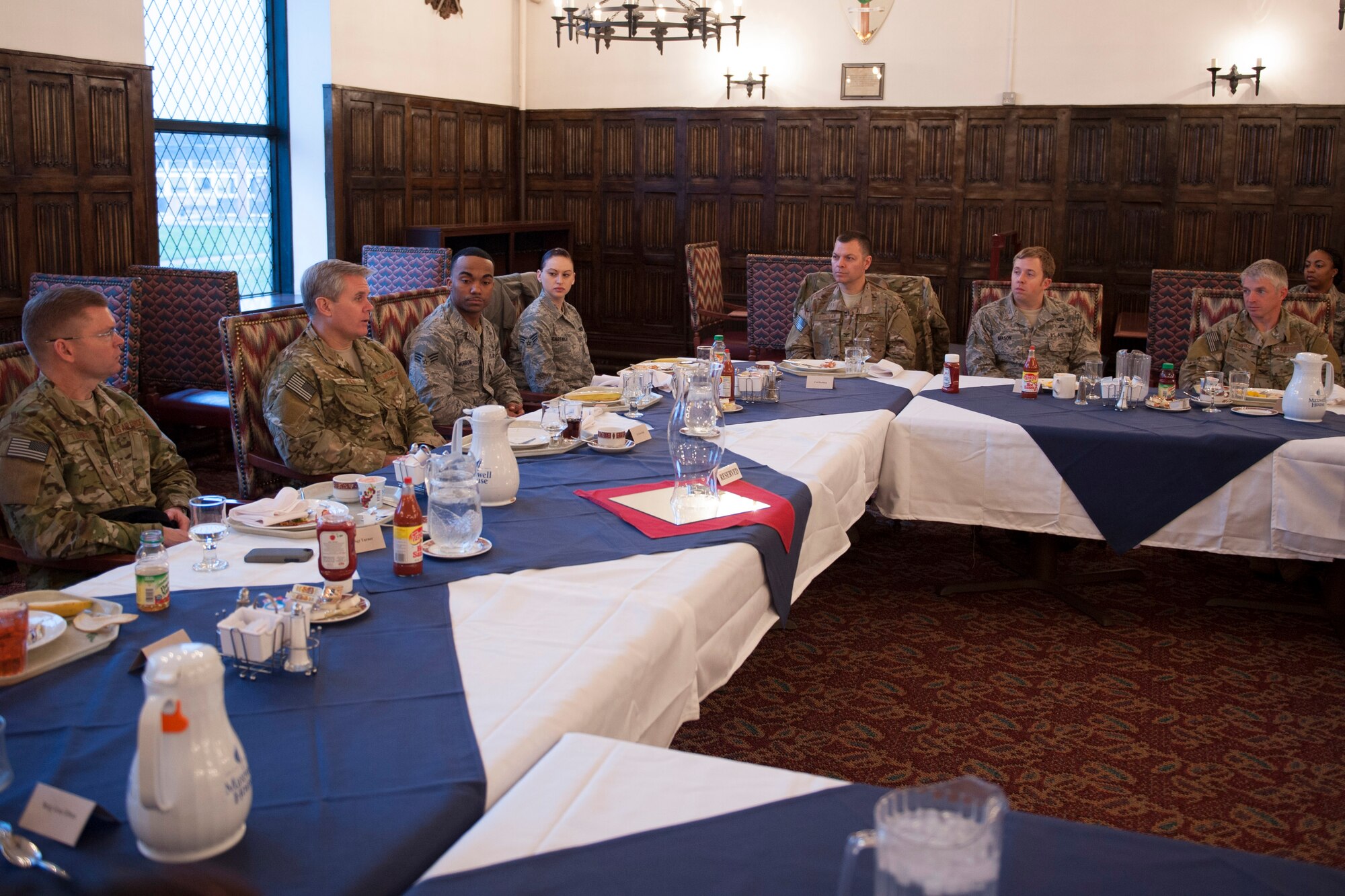 Lt. Gen. Eric Fiel, Air Force Special Operations Command commander (center, left), has breakfast with Airmen assigned to the 352nd Special Operations Group Feb. 12, 2014, during his visit to RAF Mildenhall, England. Fiel met with Airmen assigned to the 352nd Special Operations Group and toured different facilities used by the group. (U.S. Air Force photo by Staff Sgt. Stephen Linch)