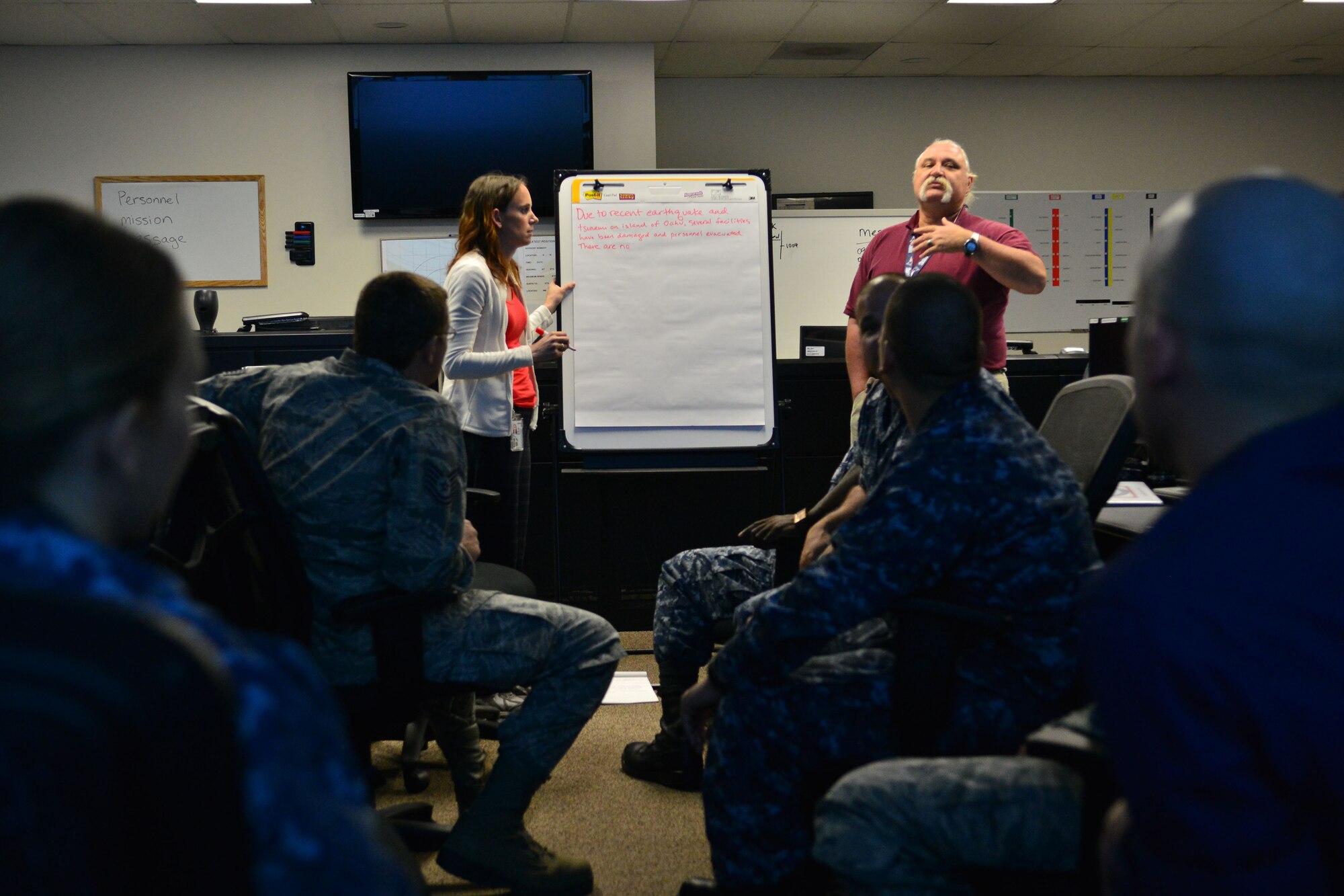 Daniel T. DuBois, Joint Base Pearl Harbor-Hickam Emergency Management
Officer, reviews the exercise scenario with students during EOC training,
held recently on JBPHH. The Emergency Operations Center is the command and
control point for Joint Base Pearl Harbor-Hickam for response and recovery
operations after any man-made or natural disaster.  The EOC also functions
as the planning and control center for major events on JBPHH including:
POTUS visits, base concerts, 4th of July, and other events of major
significance. (U.S. Air Force photo by Senior Airman Christopher Stoltz)