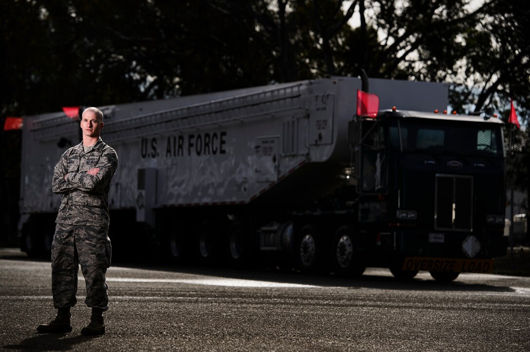 Senior Airman Jonathan Byrd, 576th Flight Test Squadron facilities maintenance technician, poses for a photo in front of an Intercontinental Ballistic Missile Transporter-Erector-Loader at Vandenberg Air Force Base, Calif., Feb. 3, 2014. Minuteman IIIs are regularly tested with launches from Vandenberg AFB to validate the effectiveness, readiness and accuracy of the weapon system as well as to support the system's primary purpose - nuclear deterrence. (U.S. Air Force photo by Staff Sgt. Jonathan Snyder/RELEASED)  