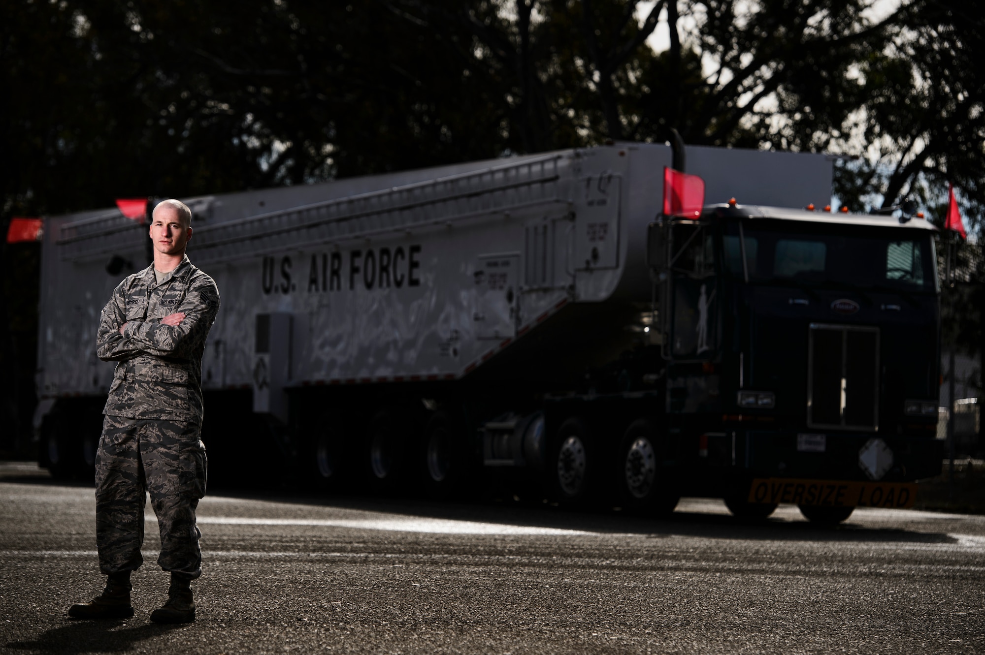 Senior Airman Jonathan Byrd, 576th Flight Test Squadron facilities maintenance technician, poses for a photo in front of an Intercontinental Ballistic Missile Transporter-Erector-Loader at Vandenberg Air Force Base, Calif., Feb. 3, 2014. Minuteman IIIs are regularly tested with launches from Vandenberg AFB to validate the effectiveness, readiness and accuracy of the weapon system as well as to support the system's primary purpose - nuclear deterrence. (U.S. Air Force photo by Staff Sgt. Jonathan Snyder/RELEASED)  