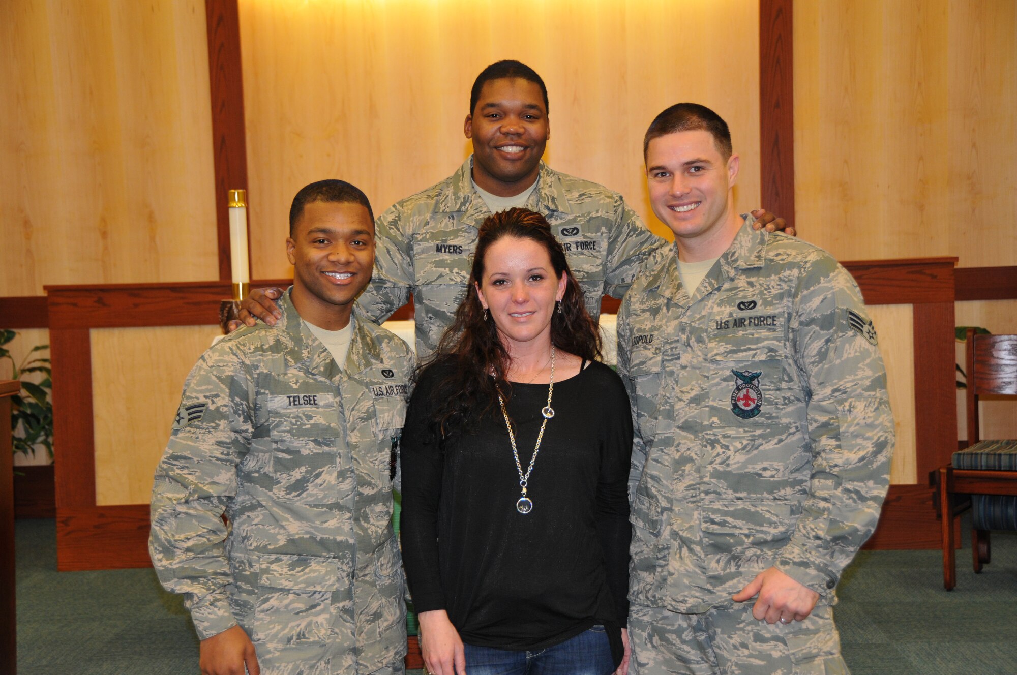 Sherry Soto, wife of Senior Airman Alberto Soto, stands with three of her husband’s  friends, Senior Airmen Kenny Telsee (left), Cedric Myers (middle) and Jonathon Leopold, following a memorial service Feb. 8, 2014, on Dover Air Force Base, Del. The memorial service was held at Chapel 1 for Soto, a firefighter with the 512th Civil Engineer Squadron, who passed away from brain cancer Jan. 31, 2013. (U.S. Air Force photo/Senior Airman Joe Yanik)