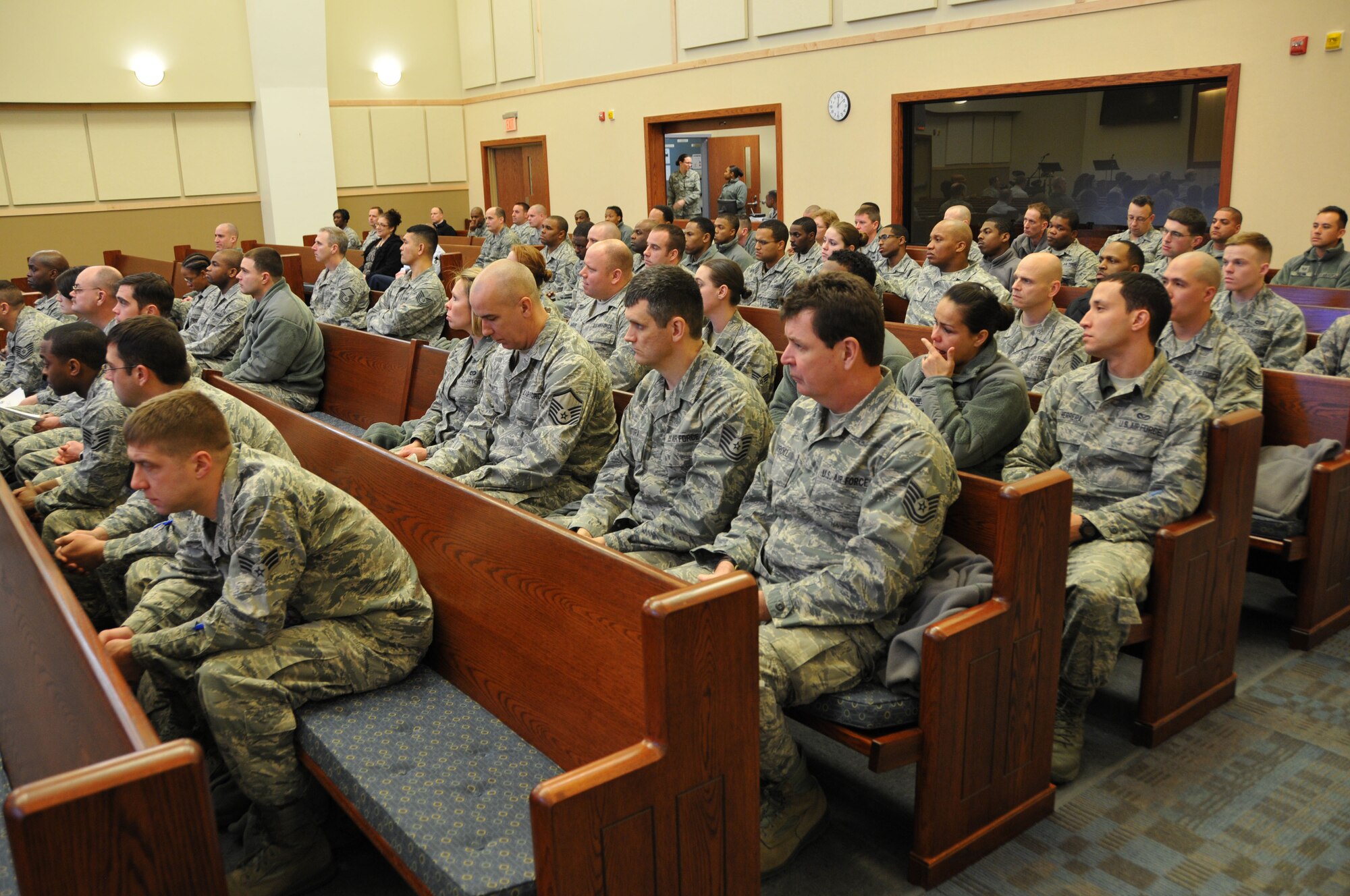 Reservists from the 512th Airlift Wing attend a memorial service for Senior Airman Alberto Soto Feb. 8, 2014, at a chapel on Dover Air Force Base, Del. The service included an invocation from 512th AW Chaplain (Maj.) Mark Flores, followed by remarks from Col. Gretchen Wiltse, 512th Mission Support Group commander, and Chief Master Sgt. Brian Cullen, 512th Civil Engineer Squadron operations chief. (U.S. Air Force photo/Senior Airman Joe Yanik)