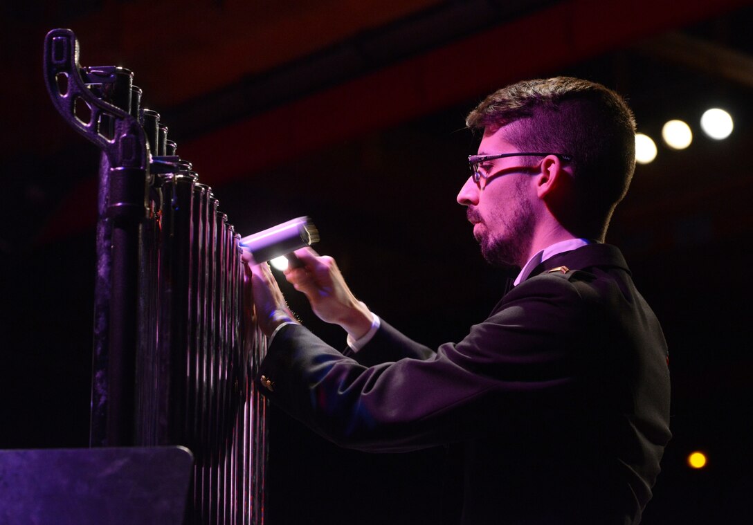 A Luxemburg Military brass player controls the sound of his instrument Feb. 10, 2014, Pont-A-Mousson, France. The bands came together to conduct five concerts in five days across Europe to foster cultural relations and promote international diplomacy. (U.S. Air Force photo/Airman Dymekre Allen)