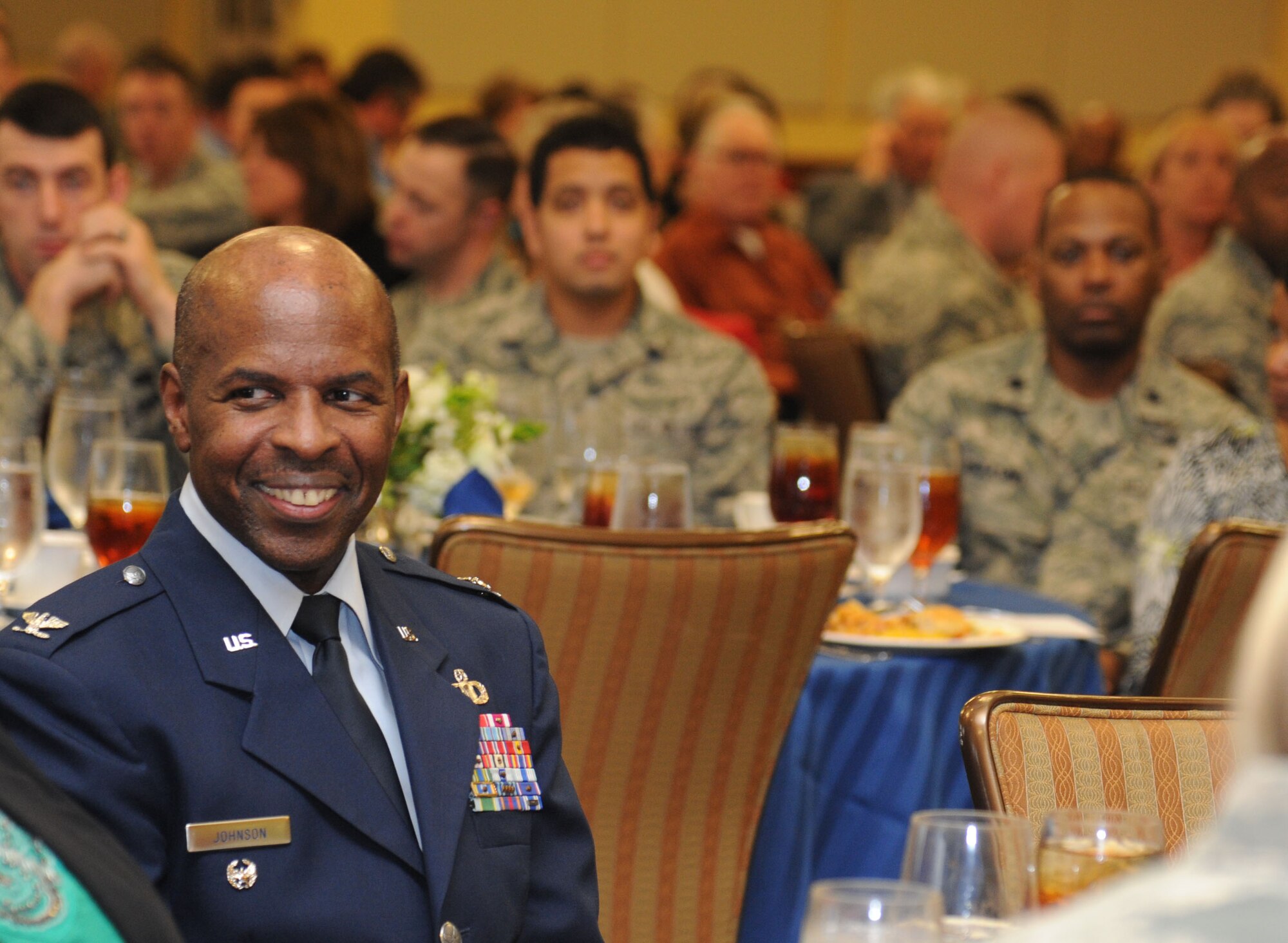 Col. Malcolm Johnson, 2nd Air Force vice commander, sits in the audience after he serves as guest speaker during the National Prayer Luncheon Feb. 12, 2014, at the Bay Breeze Event Center, Keesler Air Force Base, Miss.  The annual event, a tradition that stems back to President Dwight D. Eisenhower in 1953, allows individuals of different faiths and backgrounds to join together to reflect and develop their spiritual fitness. This year’s theme was “One Voice, United in Prayer.”  (U.S. Air Force photo by Kemberly Groue)