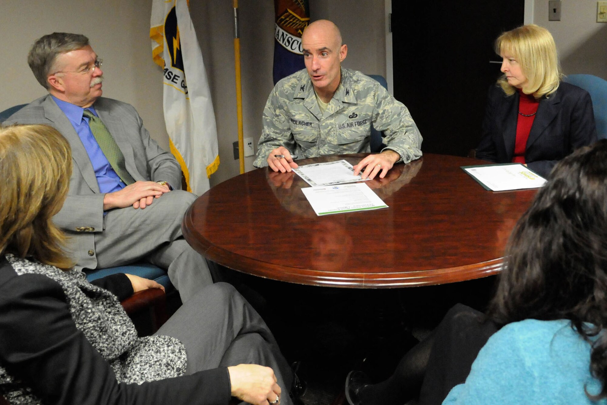HANSCOM AIR FORCE BASE, Mass. -- Col. Lester A. Weilacher, 66th Air Base Group commander, discusses with Airman and Family Readiness Center staff as well as Hanscom Federal Credit Union staff the Military Saves pledge during a meeting Feb. 4. Military Saves Week, scheduled for Feb. 24 through March 1, provides helpful tips for successful saving, establishing credit, paying down debt, planning for retirement and much more. (U.S. Air Force photo by Linda LaBonte Britt)