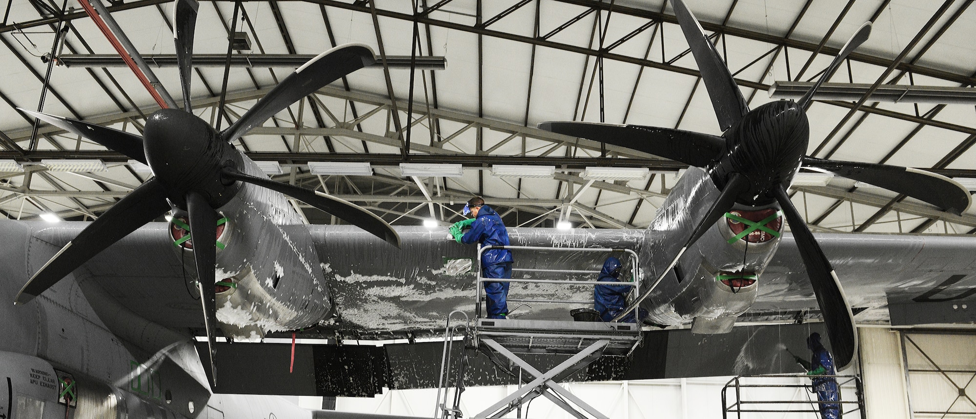 Airman 1st Class Enoch Wentland, 86th Maintenance Squadron crew chief (Left), scrubs the wing of a C-130J Super Hercules, Feb. 10, 2014, Ramstein Air Base, Germany. Airman of the 86th MXS and the 86 Aircraft Maintenance Squadron work daily to keep the aircraft mobile and in working condition. (U.S. Air Force photo/Airman Dymekre Allen)